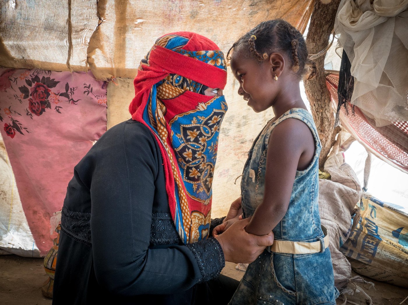 Ahlam is a 27 years old woman who lives in Algarad, the internally displaced camp in Lahj Governorate. She fled from Taiz 1,3 yrs ago.

“The clashes were very strong near our houses and our relatives could not go out to bring food or water. One day my husband went out to his regular work in a construction site, and received a number of bullets that took his soul and he left us”. 

Now she is a widow with no support, and she is looking after four children (Adyan 4 years old, Ahmed 6 years old, Taypa 8 years old & Fatima 10 years old). “I was afraid that bullets and snipers in the mountains will kill us if we approached these areas. I did not expect that my life would take this tragic turn and I would be left alone to take care of myself and my children”.

Her daily routine in the camp includes cooking breakfast for her children, but some days they do not have enough food for everyone and she has to go hungry for days so that the children can eat. She also prepares the children for school and her eldest daughters help her to bring water and firewood to the tent. 

Most of the people from her village have fled including her family, but they are not here in the camp with her. The weather in the camp is terrible and they do not have a proper roof so rain and dust in the windy weather gets inside their tent. They do not have appropriate shelter and now summer is coming with its hot winds.  It will be difficult to move around under the sun’s intense heat. Her message to the international community is to support us and our children in the displacement camps. “Help us and protect our basic rights of living in dignity. What we need most in the camp are food and water that provide us with our daily necessities in life”.

Photo: Ingrid Prestetun/NRC
