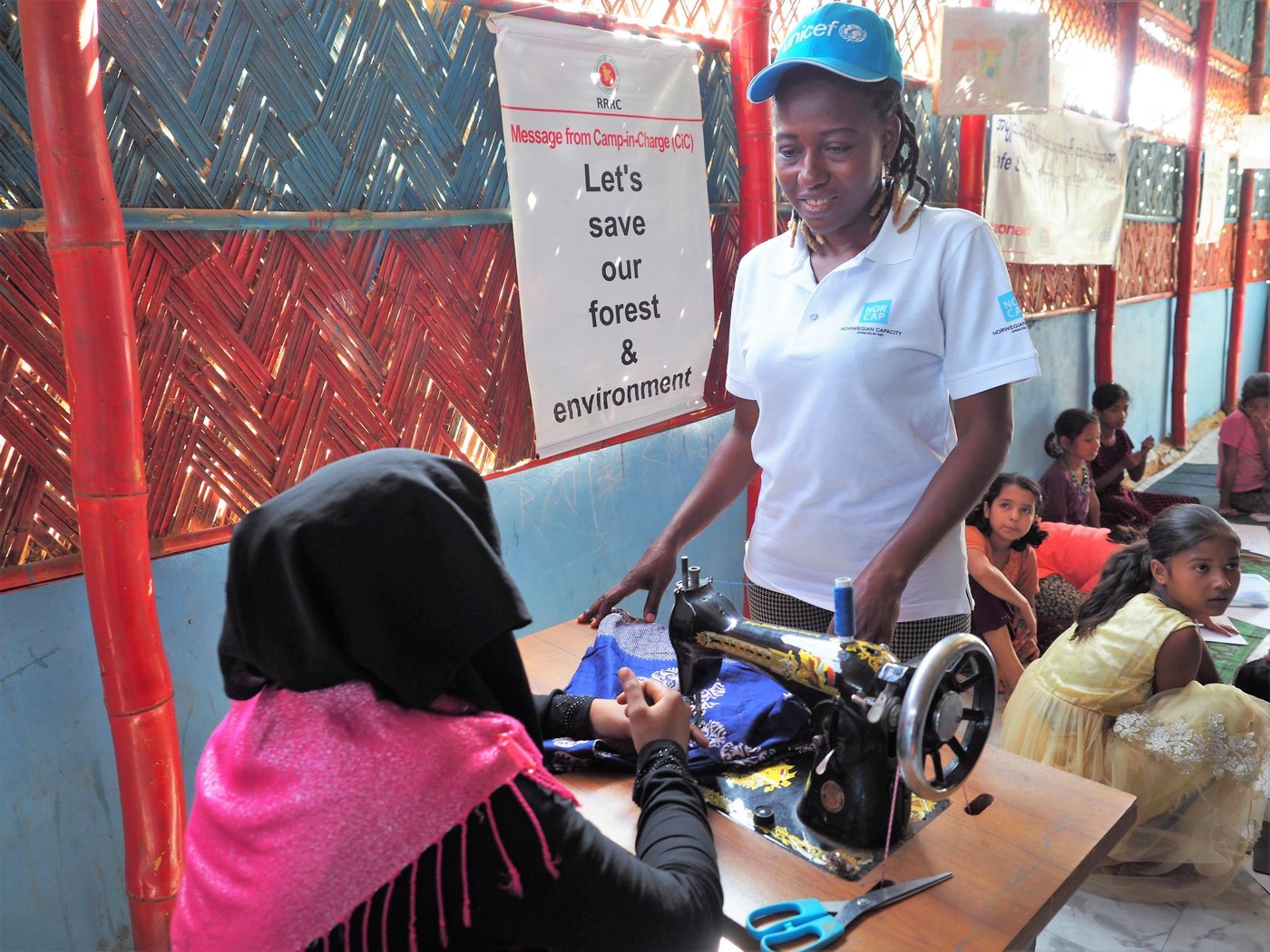 Sydoine Claire Matsinkou Tenefosso is a GBV-expert, deployed to UNICEF to the Rohingya refugee crisis in Cox's Bazar, Bangladesh. Here talking to women at a safe space for women and girls, run by UNICEF and Action Aid in the Rohingya camp. (Photo: NORCAP/Ida Sem Fossvik)