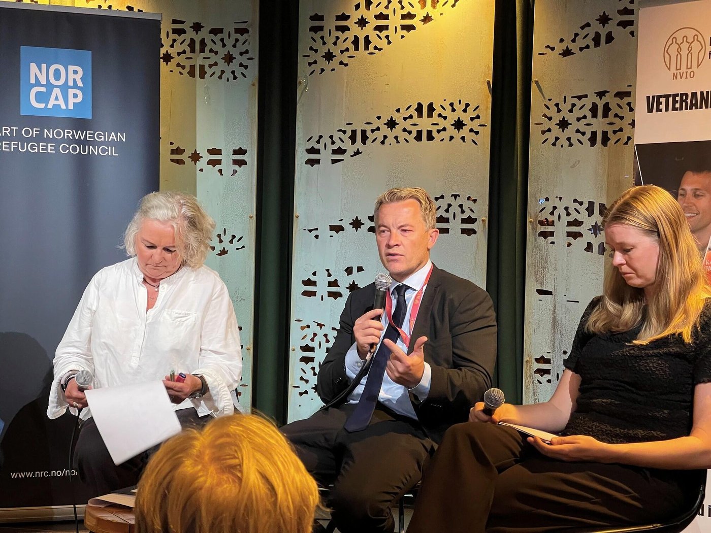 Deputy Foreign Minister, Andreas Motzfeldt Kravik from the Norwegian Ministry of Foreign Affairs, speaking in a panel discussion, with Christine Fossen, former Police Commissioner, United Nations Mission In South Sudan (UNMISS) to his right and discussion moderator Trine Østereng to his left. 