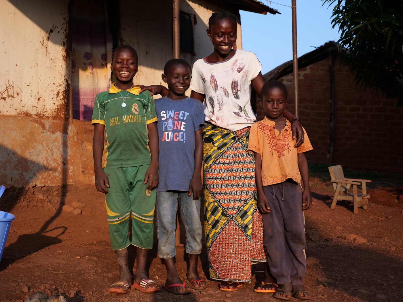 Nuela poses with three of her sons, Kolo, 10, Jospin, 8, and Cedric, 7 outside of their house in Boali, Central African Republic.
Photo: Itunu Kuku/NRC
Date: July 13 2021