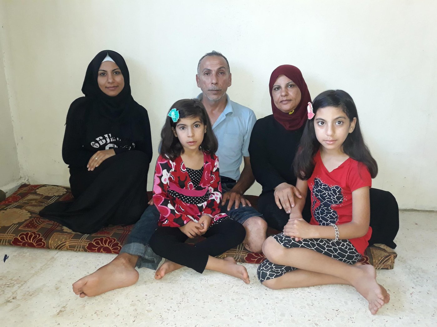 Zayno, 48, and his family fled to Lebanon in 2013 after losing his home and his left leg in a missile strike blast that hit his neighbourhood in Homs, Syria. Today, he lives in a small apartment together with 10 other family members in north Lebanon.
“My daughters’ are losing their childhood, they do not enjoy it the way a child should. Before Covid-19, they used to play outside all the time, now they are trapped inside the house and they are bored all the times, it is a disease itself," Zayno says.
Photo: Khalid Wehbi/NRC