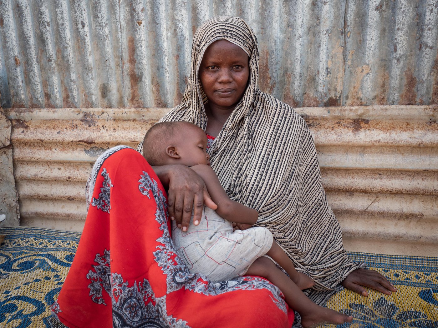 In September 2019, Mariam Farah Hussein, her husband and seven children fled Mogadishu for Bosaso, on Somalia's northern coastline. The family left their home during shelling on their neighbourhood that subsequently hit and destroyed their home completely.

“I lived in constant fear. There were a lot of explosions every day. People were killed every day, murdered – anything could happen. Because of this fear we decided to flee.”

“We have seen a lot of problems. When I left my home, it was hit by bombs. I suffered when I was travelling. After I arrived here, I forgot all my problems and fears. I feel safe.” 

Photo: Ingrid Prestetun/NRC