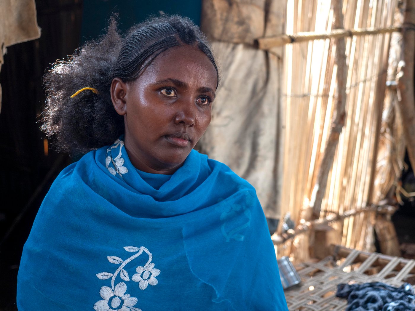 Rahwa was 8 months pregnant when the conflict in Ethiopia broke out. Her husband left to help defend his family, and Rahwa was left to decide the fate of her children alone. She had no choice but to flee to protect her children. Rahwa took her nine year old son's hand and walked for days until she reached safety in Sudan. One week after she arrived, Rahwa gave birth to her now one year old son. She is in constant worry for his future, and wishes peace would come in her country so she can give her children a stable life.
Photo credit: Ingrid Prestetun/ NRC