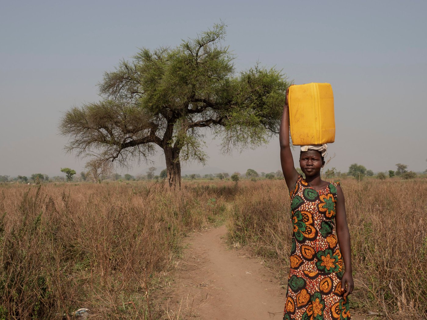 Athieng (20) student at the Accelerated Education Program in Nyumanzi, Adjumani District. Athieng fled from South-Sudan to Uganda in 2015 with her two brothers and mother, after first staying 2 years in Kenya. They live 25 km from the border to South-Sudan.
In Nyumanzi Settlement in Adjumani, Uganda Athieng gave birth to twin daughters in 2019 and her mother is taking care of them while Athieng is in school. Her father is still in South-Sudan.
Athieng is now attending last year of primary school in NRCs Accelerated Education Program. She and her 14 year old brother is attending the same class. AEP in Nyumanzi has more than 200 students from the age of 10 to 20 years. Athieng has a dream to become a nurse in the future.
Location: Youth Center in Nyumanzi Settlement, Adjumani District, Uganda
Photo: Ingrid Prestetun/NRC