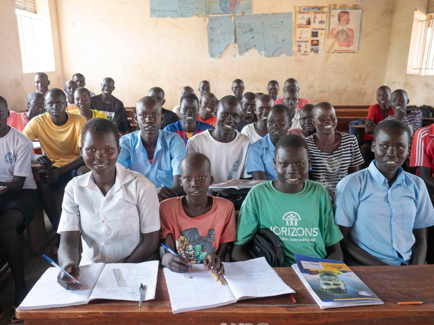 Athieng (20) student at the Accelerated Education Program in Nyumanzi, Adjumani District. Athieng fled from South-Sudan to Uganda in 2015 with her two brothers and mother, after first staying 2 years in Kenya. They live 25 km from the border to South-Sudan.
In Nyumanzi Settlement in Adjumani, Uganda Athieng gave birth to twin daughters in 2019 and her mother is taking care of them while Athieng is in school. Her father is still in South-Sudan.
Athieng is now attending last year of primary school in NRCs Accelerated Education Program. She and her 14 year old brother is attending the same class. AEP in Nyumanzi has more than 200 students from the age of 10 to 20 years. Athieng has a dream to become a nurse in the future.
Location: Youth Center in Nyumanzi Settlement, Adjumani District, Uganda
Photo: Ingrid Prestetun/NRC