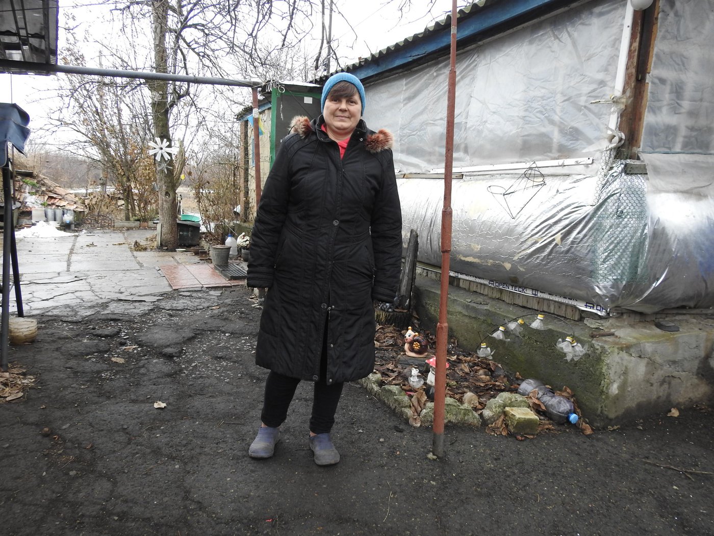Svitlana Shavlinska, 51, is an internally displaced person from non-government-controlled Pervomaisk. Since October 2014, she lives in a small house in the frontline village of Orikhove.
Svitlana went to her hometown only twice during the whole time: “My property is damaged there due to explosions near the house – at first the windows were blown out, and then there was a fire.”
Since then, Svitlana has been actively following various humanitarian and development organisations’ activities, attending information sessions in the village, and proposing her own ideas. Last year, Svetlana even received two business grants to purchase sewing and embroidery machines.
“When I lost a job as a cleaner at a local school and registered at the employment centre, there was an opportunity to study and get an additional profession – a seller of industrial goods. So I decided to start my own business. At first, I was doing clothes repair. And now I carry out the production and sale of goods. Tailoring was my childhood dream that only came true under such circumstances.”
Since December 2020, about 40 people have already received legal information from Svitlana on topics of most interest to the village population: subsidies, an inheritance of the real estate, pension and social assistance.
“I began to actively provide paralegal services, once completing an NRC training course on legal and protection issues, including Covid-19 awareness-raising sessions. Some topics are very close to me as an IDP with similar pressing issues,” says Svitlana.
The frontline communities, such as Svitlana’s, with up to 200 residents, are often isolated and hard to reach. Within six years, almost all young people left them. There is no work. Schools are closed or restructured. Despite the existing ceasefire regime, residents frequently hear gunfire sounds during the day.
Photo: Violetta Shemet/Norwegian Refugee Council