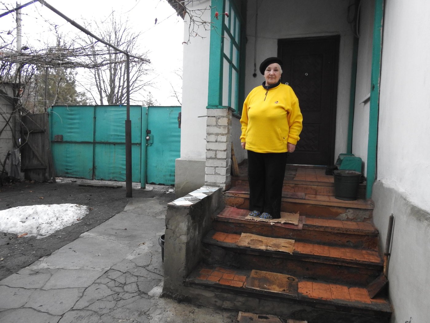 Valentyna Bochko, 72, is an officially registered volunteer and devotes all her time to help her fellow villagers. All the life she lives with her husband, who works at a local school, in the village of Nyzhnie. Before retirement, Valentina was the headmaster of that school. She worked there for 40 years.
“People always sought my advice, help, and just a kind word, as the headmaster of the village school. And now they come to me as a volunteer who cooperates with many relief organisations. Even regarding the lack of electricity in the village, they do not turn to the village council, but me.”
She collaborates with HelpAge International specialists, who have told her about the new NRC project.
“Just before you [NRC], a woman asked me to resolve the issue of providing hygiene products to her low-mobility relative. And even though I have nothing to do with such things at first glance, I will still help. I have already contacted one local humanitarian organisation that previously provided such assistance,” says Valentyna.
As an NRC paralegal, Valentina shares the knowledge, gained during a series of training, with her fellow villagers, disseminating legal information.
“People come up to me in the market or the store. Anyway, everyone in the village has my phone number. Now, especially with the coronavirus, few people come in person, they call more, asking various questions. The most popular topics are the subsidies and the assignment of a child’s status affected by the military conflict.”
The village, where Valentina lives, combines three smaller parts, where about 2,000 people live; about 50 of them are displaced.
“They are all I have got. People say that I am the most reliable person from whom you can get real help. Of course, there are several issues that I cannot solve without professional intervention. In such cases, I make referrals to NRC specialists. Moreover, there are already about ten such cases. Usually, these are complex issues, for example, refusal to pay compensation for destroyed housing, the documents for which remained in the uncontrolled territory,” explains Valentyna.
Despite her age, Valentina is actively mastering the equipment and not going to stop.
 “I love this business. And I am not afraid that I do not receive money at all. Sometimes there is a backlog. But my husband helps to compose lists, prepare printed copies. And I negotiate with the village council, if a place is needed for holding meetings with the community for humanitarian organisations or prepare announcements of such events.”

Photo: Violetta Shemet/Norwegian Refugee Council