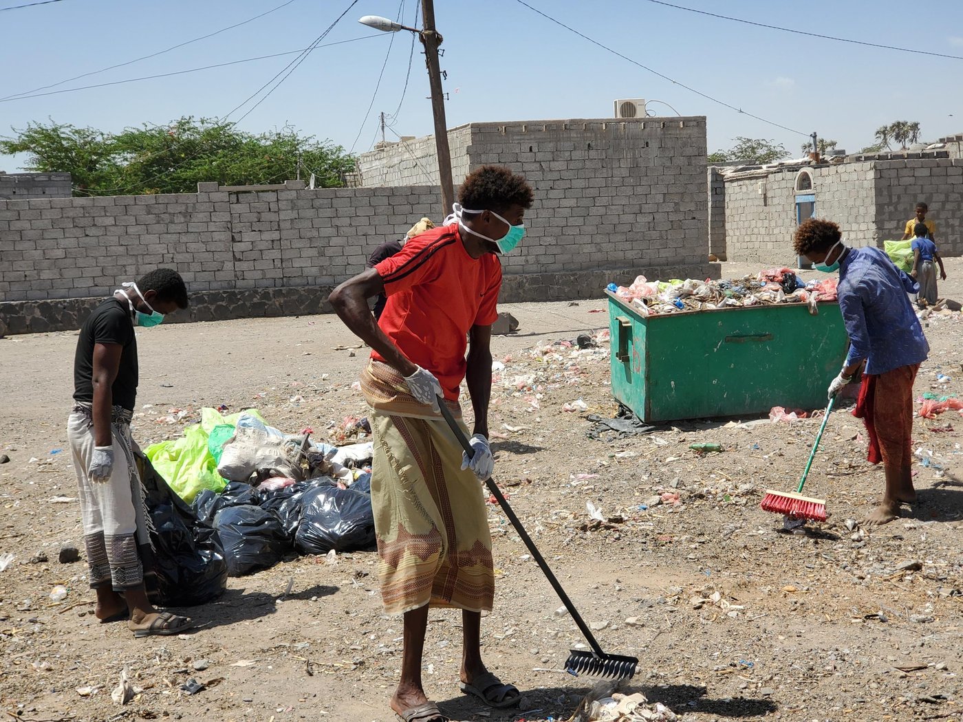 “Nothing is better than seeing my city clean.” Hisham Abdullah has been a cleaner for more than ten years, in his home city of Mocha. “I work every day from early in the morning until noon,” he says.
He is grateful for his job with the local council, which is the only source of income for his family of seven. But it is not an easy job, as there is a lot of physical effort needed to sweep the streets and heft heavy rubbish bags. And at times it is made harder by the attitudes of Hisham’s fellow residents.
“Sometimes we can face insulting remarks from people,” he admits.
Perhaps for this reason, Hisham has always appreciated those who have been supportive of his work, helping to clean outside their houses and shops. “When the community joins us in a cleaning campaign,” he explains, “it encourages us to work harder.”
But recently, Hisham has been aware of a shift in attitudes. Because on 10 April 2020, Yemen confirmed its first case of the novel coronavirus: Covid-19.
Before the conflict, Mocha was a small coastal city, known for its fishing—and also long ago as a major coffee port, after which the café mocha is named. But in the last three years it has become a destination for thousands of displaced families seeking safety from the conflict. This influx of people has meant an increased need for cleaning teams like Hisham’s.
“We clean all camps in the city and around it,” Hisham explains. “The displaced people appreciate our work, to be honest. Most of them collect their rubbish in plastic bags and put them in the in front of their tents.”
Not everyone was so supportive. But since Covid-19 has hit Yemen, people are taking cleaning more seriously. Even those who had previously been uncooperative now see hygiene as a priority.
“Everyone started to respect us and help us in cleaning their neighbourhoods,” Hisham says.
In the wake of the first confirmed case, Hisham’s team is one of many being supported by the Norwegian Refugee Council (NRC) to step up their efforts to keep local markets and camps clean. This is part of a range of new measures NRC has rolled out to help combat the virus.
“Cleaning is not a new thing for us, we have been doing it for years,” Hisham says. “But the NRC training showed us how to work safely so we won’t be affected by the coronavirus or help spread it.”
Hisham was particularly glad of the protective equipment that came with the training. “NRC provided us with gloves, face masks and cleaning tools.”
“The happiest day for me,” Hisham says, “is when I see that Mocha is clean, and people are helpful and aware about the importance of cleaning.”
Photo: Zaid Al-Haimi/NRC