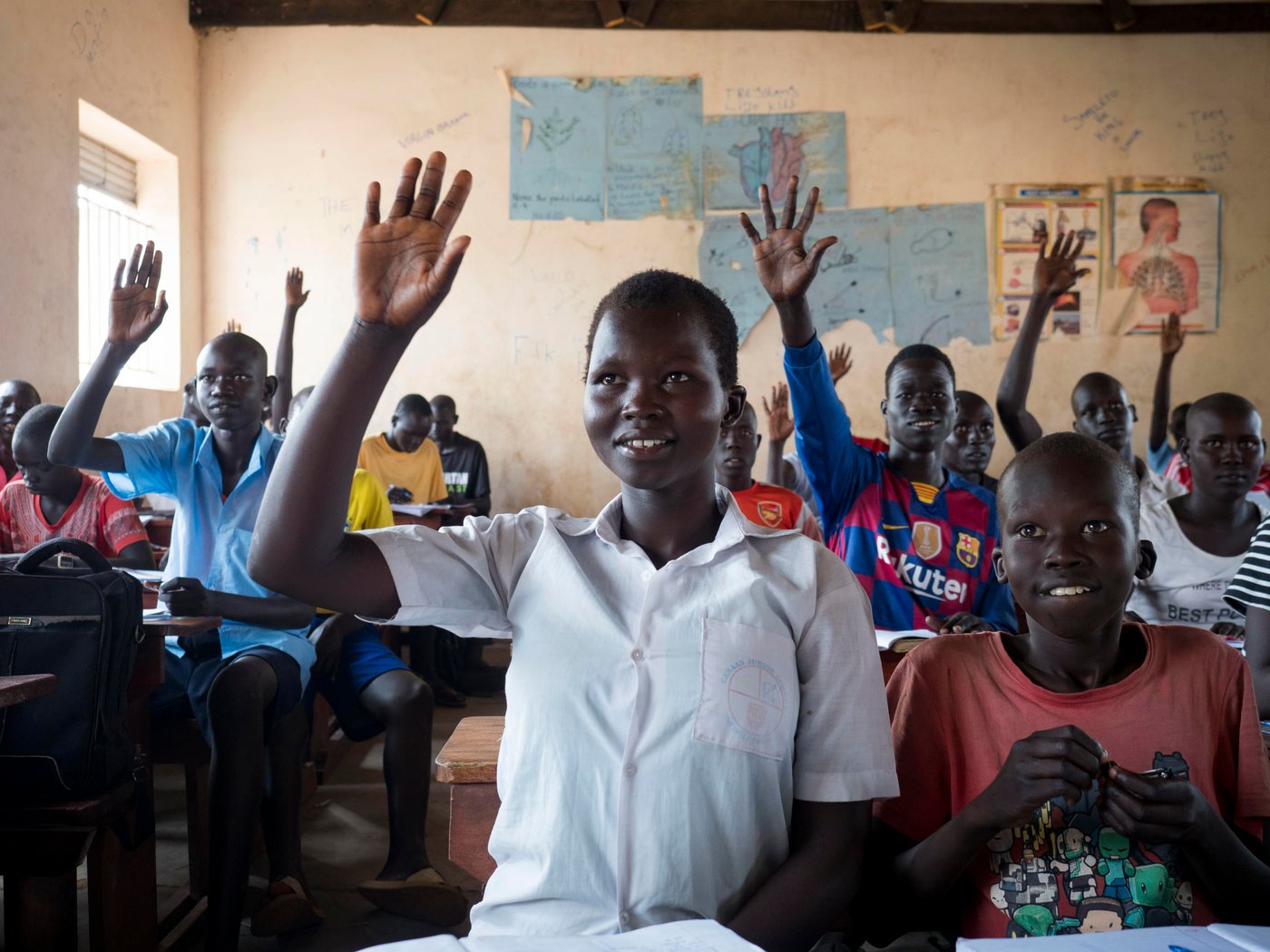 Athieng (20) student at the Accelerated Education Program in Nyumanzi, Adjumani District. Athieng fled from South-Sudan to Uganda in 2015 with her two brothers and mother, after first staying 2 years in Kenya. They live 25 km from the border to South-Sudan.  

In Nyumanzi Settlement in Adjumani, Uganda Athieng gave birth to twin daughters in 2019 and her mother is taking care of them while Athieng is in school. Her father is still in South-Sudan. 

Athieng is now attending last year of primary school in NRCs Accelerated Education Program. She and her 14 year old brother is attending the same class. AEP in Nyumanzi has more than 200 students from the age of 10 to 20 years. Athieng has a dream to become a nurse in the future.

Location: Youth Center in Nyumanzi Settlement, Adjumani District, Uganda
 Photo: Ingrid Prestetun/NRC