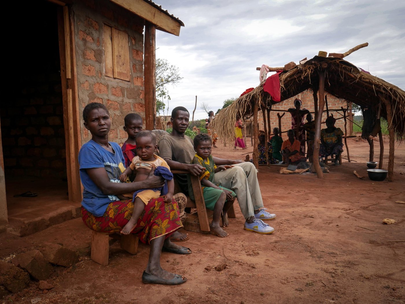 Destin, 41, father of 5 children. With his family, Destin fled an attack against his village in 2014. “We fled and hid in the bush. We lived like animals for two years in the bush” says Destin, a displaced from Zaire, a village located about 100km from Carnot, western Central African Republic.
“We didn’t take any bag with us. We just fled. They killed 5 persons of our village including my aunt. She was shot three times; one to her neck, one to her chest, and another one to her lower abdomen.
“I had not returned there but a few days after the attacks, neighbors who went back to check on their property found her body, swollen, in state of decomposition. They dug a hole and buried her there.
“I could not distinguish if it was the Peuhls or anti-balaka militia that we firing at us. I don’t meddle into politics, I don’t carry weapons, I don’t know how to fight, so why did this happened to us?
“It took us a year with my family to be reunited together in the bush. We fled in a scattered fashion, walked along the Mambéré River.
“Every day was about survival. Each day I wondered whether I will die or live. Within the first months of our flight, we could still hear gunshots. I would turn around to make sure my wife and children weren’t shot by a stray bullet.
“ we built a shelter made of tree leaves, straw and wooden sticks to sleep at night.
“The women would return to the village to find out if there was anything left they could bring back to eat. They would also take whatever they find dans les champs.
“After two years, fighting calmed and headed to Carnot. I found a home that was unoccupied. I just wanted to find a safe refuge for family until we could go somewhere else. I cleaned the house, put doors and windows on it. We lived there for another two years until the daughter of the owner of the house showed up. They had fled too and now intended to return. This was not my house and after mine was burned down, I understand too well the need to have a home. I promised the daughter that we would leave before they would returned.
“One day, I was told about construction of homes to start. I volunteered to help clean the site and then I was allowed to build my little home. That’s how I ended up here.
“After several years of living in fear and suffering, I am finally well with my family. There are still little struggles we face like not having enough food since we don’t have a sufficient and regular income but knowing that we don’t need to move again is a relief.
“We had a few ugly years. It’s behind now and I won’t resent anyone but it still hurts. It used to cry but now life has improved.”
NRC with funds from UNHCR secured a piece of land in the district PK5 , Carnot, on which IDPs who vacated homes of returnees could build a little home.
Credit: Hajer Naili/NRC