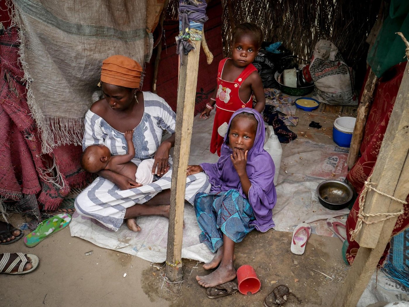 Suweba is 35 years old. Thirteen days after fleeing her hometown with her four children, she gave birth to a baby girl. Her husband remained behind when insurgents entered her hometown to ask them to leave. Since then, she hasn’t spoken to her husband and doesn’t know whether he is alive or dead. Credit: Hajer Naili/NRC