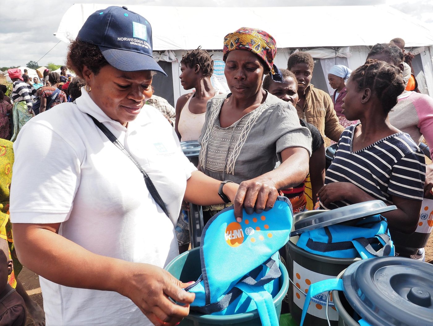 Felicité Molengar, NORCAP gender-based violence expert demonstrating the contents of a dignity kit in the Cura resettlement site in Nhamatanda, Mozambique. 

"When an emergency happens, women and girls are often the most vulnerable. The usual forms of protection in a community are broken, and being there to provide them essential and rapid assistance is what motivates me the most", Felicié says. 

(Photo: NORCAP/Ida Sem Fossvik)