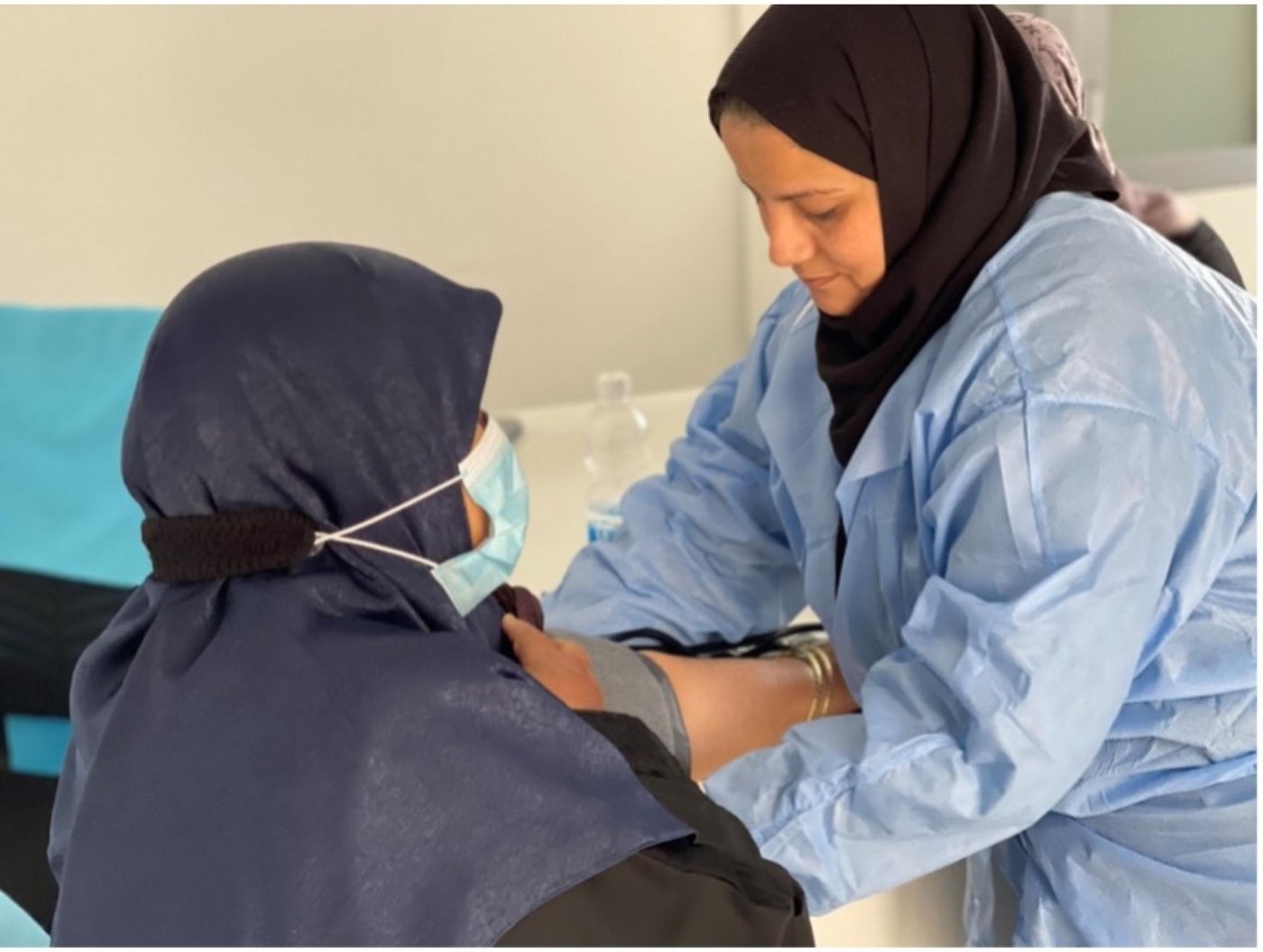 Nurse takes blood pressure of a diabetic patient at newly rehabilitated medical center in Abu Salim near Tripoli, Libya.

Photo by Nada Fituri.