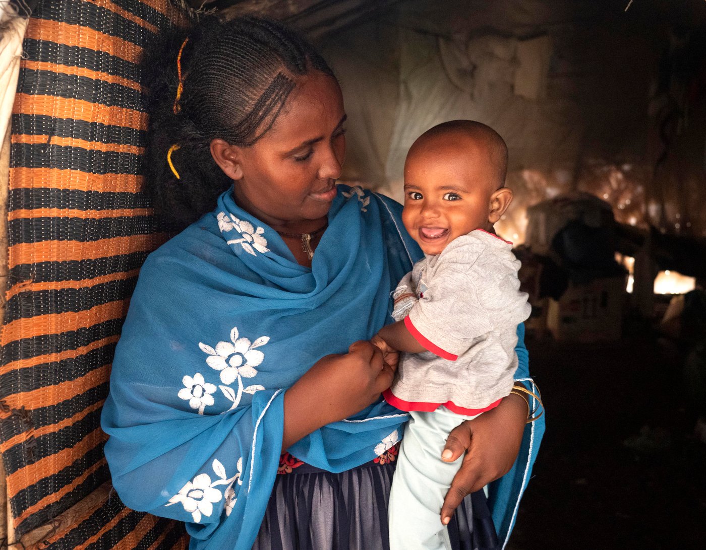 Rahwa was 8 months pregnant when the conflict in Ethiopia broke out. Her husband left to help defend his family, and Rahwa was left to decide the fate of her children alone. She had no choice but to flee to protect her children. Rahwa took her nine year old son's hand and walked for days until she reached safety in Sudan. One week after she arrived, Rahwa gave birth to her now one year old son. She is in constant worry for his future, and wishes peace would come in her country so she can give her children a stable life. 

Photo credit: Ingrid Prestetun/ NRC