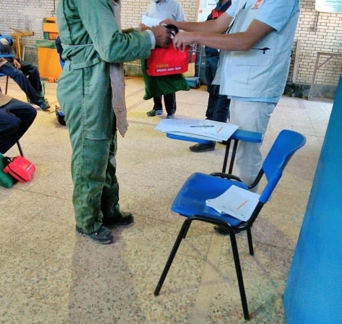 An Afghan man from the Rafsanjan settlement participating in vocational training receives his Occupational, Health and Safety kit, funded by the Danish International Development Agency (DANIDA).
Photo: Society for Recovery Support
