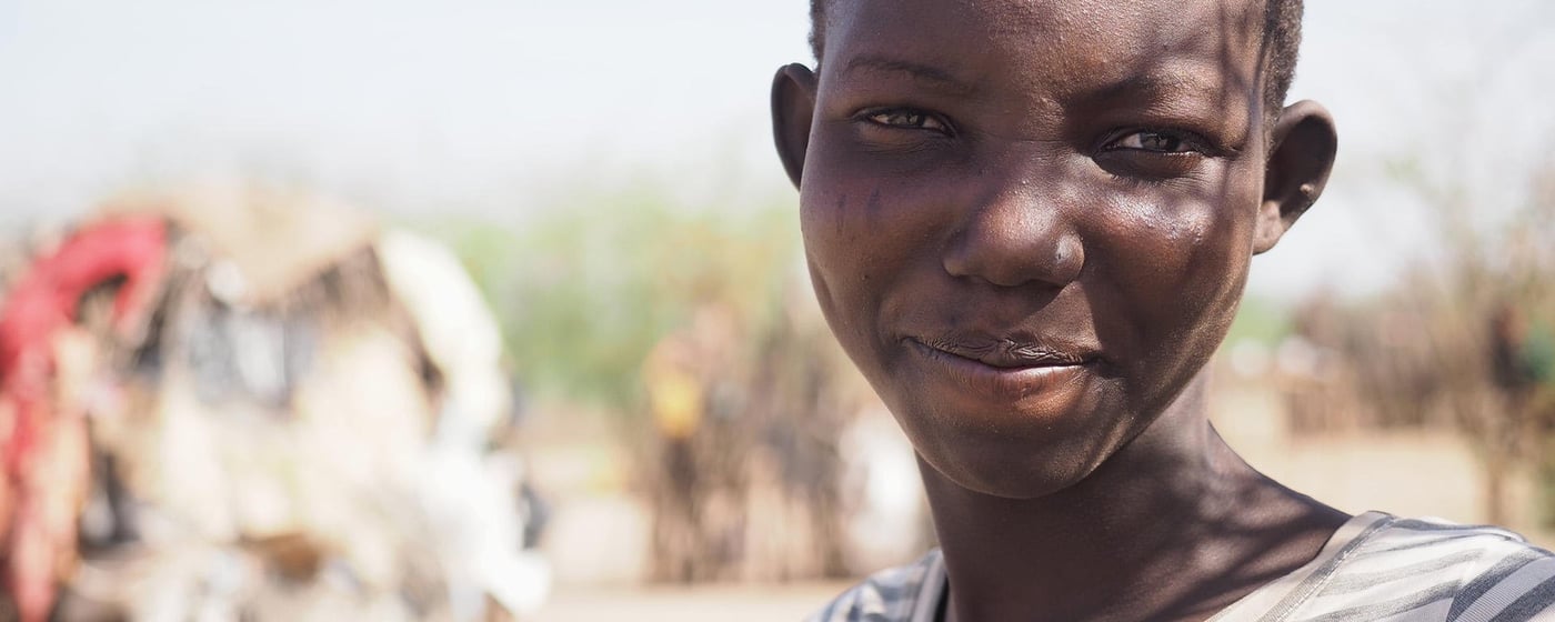 Portrait of a smiling 14-year-old girl.