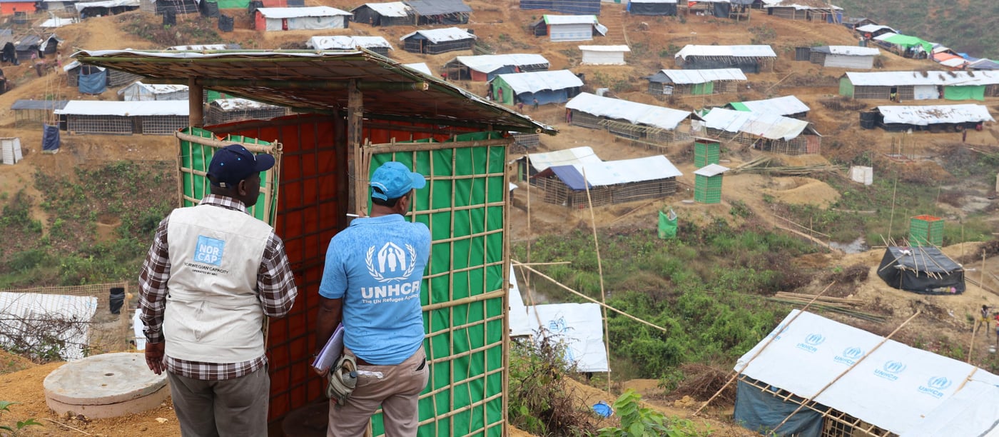 NORCAP water, sanitation and hygiene expert, Patrick Loum, with a colleague from UNHCR, checking newly constructed latrines in the Kutupalong refugee camp. (Photo: Ingrid Prestetun/NRC)