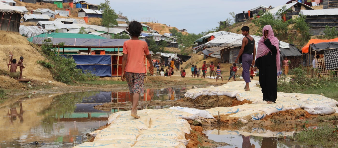 NORCAP experts have helped construct elevated foot paths to keep refugees from having to walk in mud and sewage water. (Photo: Ingrid Prestetun/NRC) 