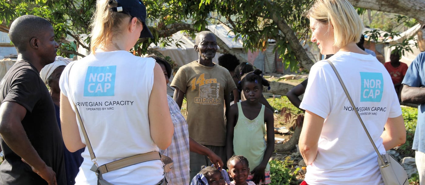 NORCAP protection expert Helene Ruud talking to survivors after hurricane Matthew in Jeremie, Haiti. The hurricane destroyed many homes and most of people's livelihoods and many are dependent on food aid. (Photo: Ingrid Prestetun/NRC)