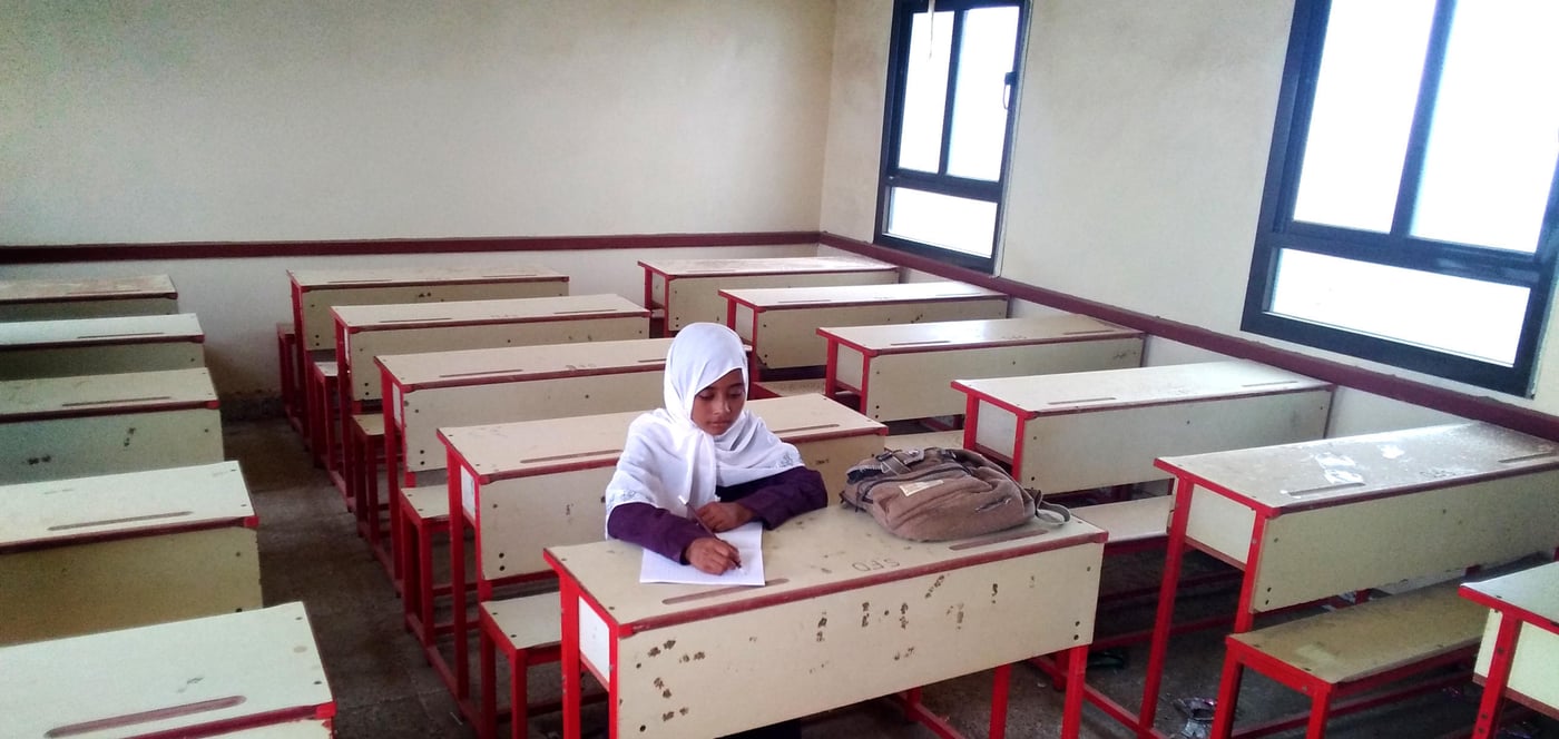 Raghad, a student in the sixth grade at primary school, sits in her repaired classroom at Saif Bin Dhi Yazan School. Her school in Taiz's Mocha district was badly damaged by the conflict, until it was rehabilitated by NRC with the support of ECHO. Schools in Yemen have been closed since March due to Covid-19, but are due to re-open for the new academic year.

Photo: Abdulrazaq Mohamed/NRC