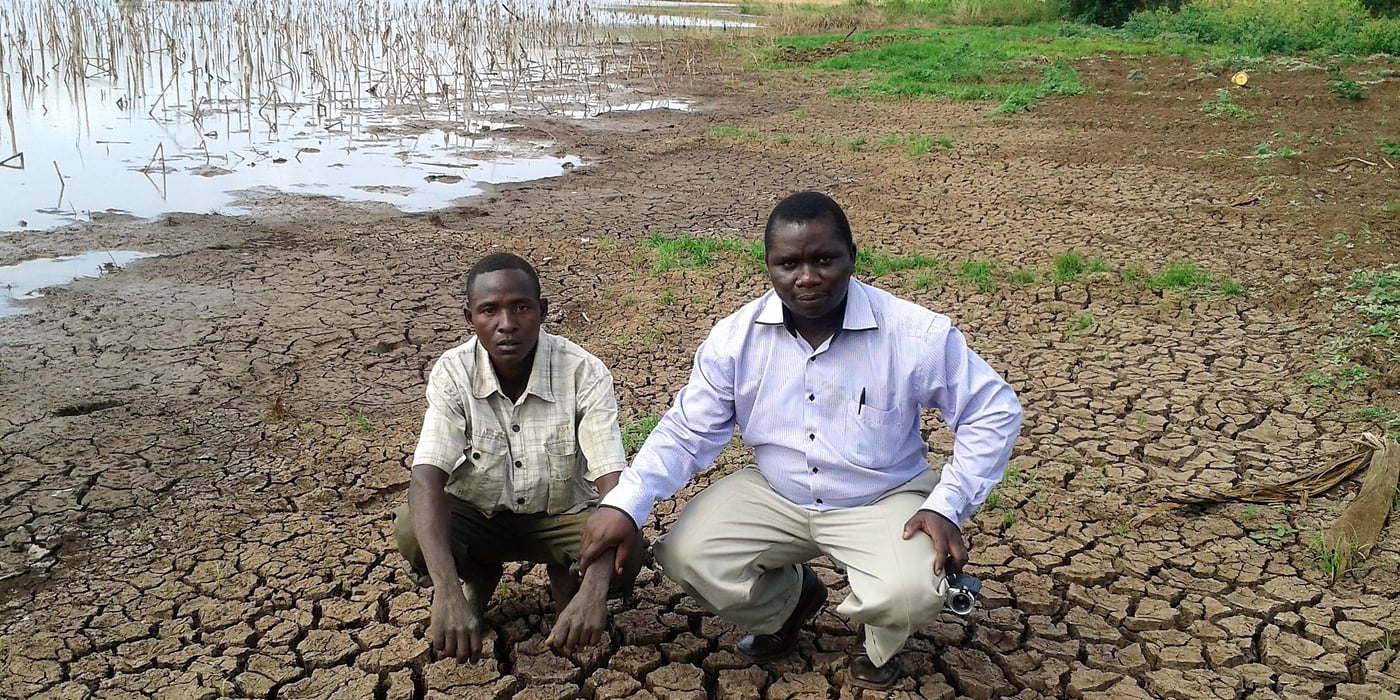 NORCAP Climate Information Services Expert, Philip Omondi (right) with a local representative showing impacts of prolonged drought in Tana River County. The drought was exacerbated by 2016/2017 La Niña phenomenon (Photo: Philip Omondi/ICPAC/NORCAP)       