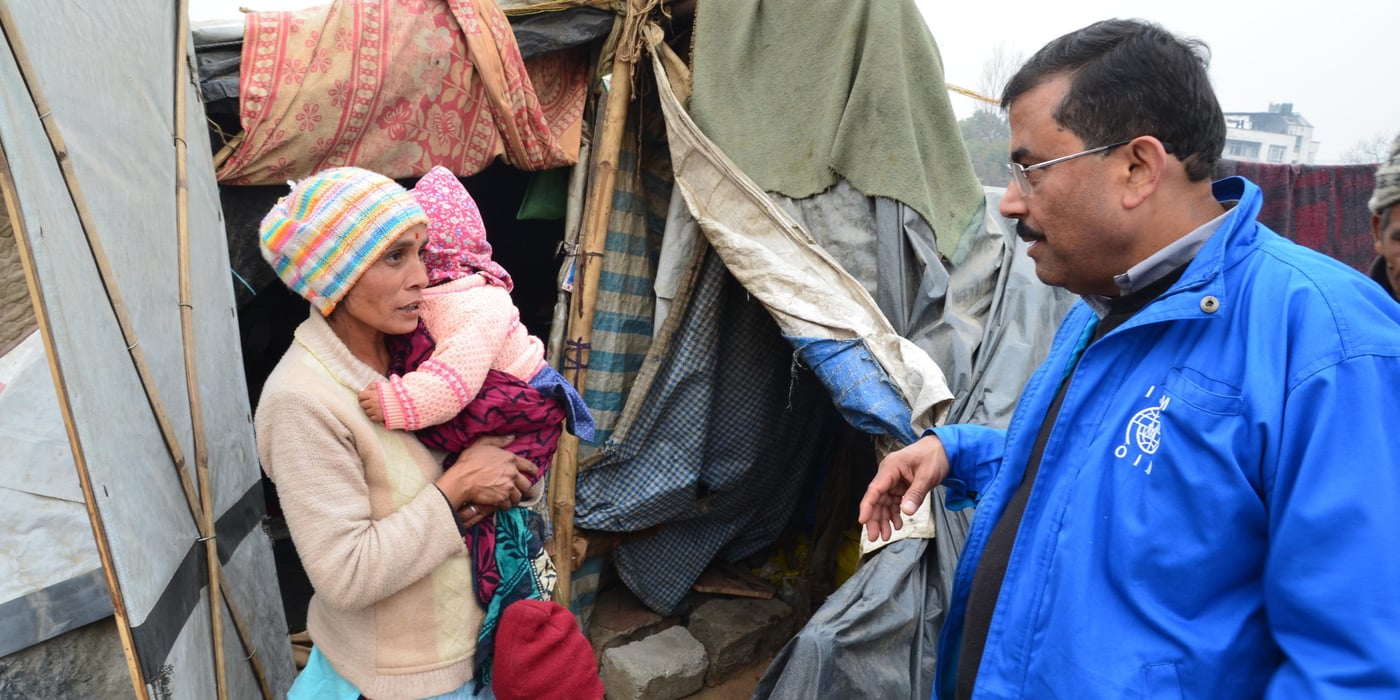 Kumari Kafle with her two children, Kusum (3) and Khushi (nine months), talking to NORCAP deployee Leela Raj Upadhyay. Their house collapsed in a landslide following the earthquake in April 2015 and since then the family has been living in makeshift shelter in the Chuchhepati IDP site in Kathmandu.   " My husband is a day labourer and sometimes some organisations bring us some cash, but other than that, we have no plan for the future. We can't go back because we have no money to rebuild our house and there is no land left because of the landslide", Kumari says. (Photo: Ida Sem Fossvik/NORCAP)