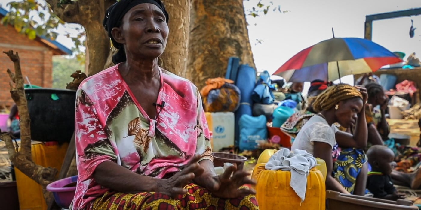 Anne fled her village when armed groups attacked in the morning of the 19th of January. She was going back home from the church when she saw armed men arriving from the bush.

"I saw them deep in the bush. My house is at the end of the village. They came in a column. As soon as I saw them, I immediately understood that it was the rebels. 

I left immediately, without taking anything. I only caught what was around me.

Since we have been here, we have stayed under this tree. We are on the ground. We are suffering a lot and we have nothing to eat.

It was the good people who brought us cassava leaves. The price of cassava has risen and we are finding it difficult to eat.

Even the children are suffering. They have lost all their school supplies. They go to school without a bag, without a notebook, without a slate, without clothes. What I can tell you is that we are suffering," says Anne.

Date: 8th February 2021
Location: Liton village - 22km from Bangui
Photo: Tom Peyre-Costa/NRC