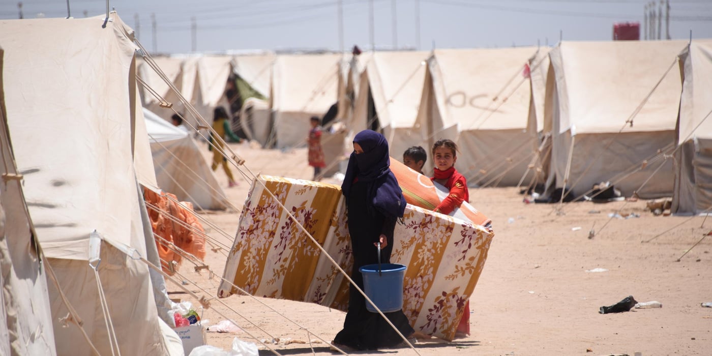 Newly arrived Iraqis from Fallujah collect emergency aid distributed in the displacement camp in Amariyat Al Fallujah.
Photo: Karl Schembri/NRC