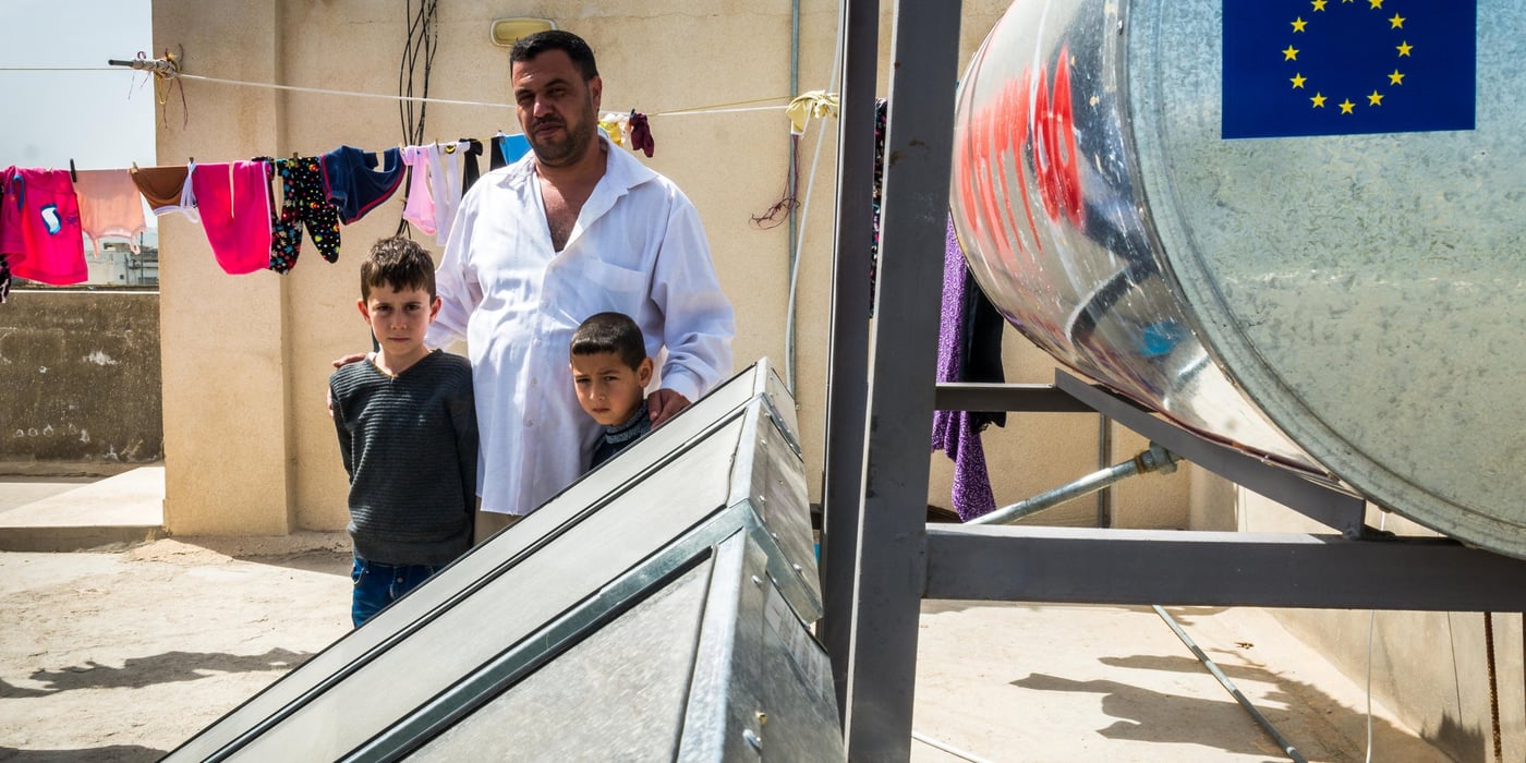 Basam (38) a refugee from Syria stands on the roof of the building where he rents an apartment near Irbid in Jordan. As part of a project by NRC, the Jordanian Ministry of Energy and the EU, his family now enjoys hot running water from the solar heating system recently installed on the roof.
March 9th 2016
Photo John Cutliffe/NRC