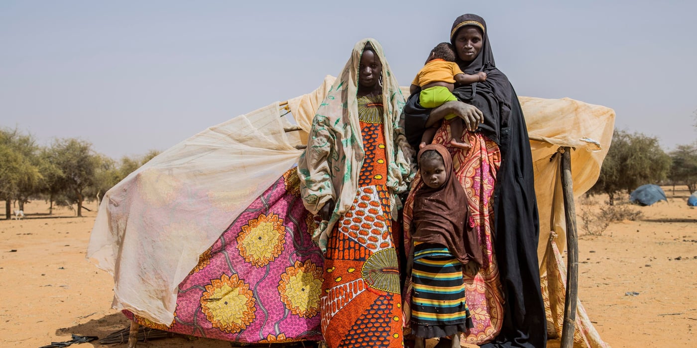 Aigachatou, a single mother and her children, standing in front of their makeshift tent after fleeing violence in Timbuktu in Mali.
Photo: Togo Moise/NRC