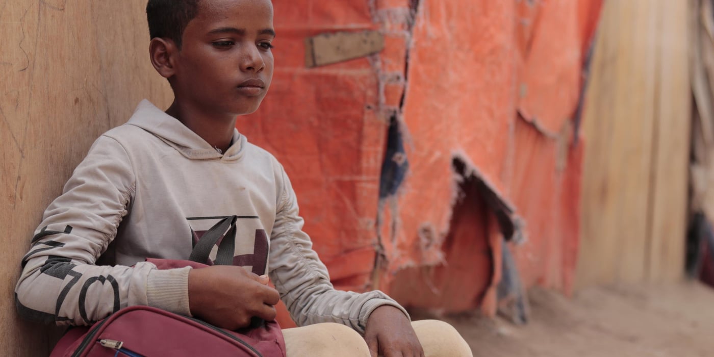 Photo: Mahmoud Al-Filstini/NRC
Details: Walid Mansour Ali Abdu, aged 12, had to flee his home because of the conflict. He lives now in Al-Meshqafa camp in Lahj governorate. Before Covid-19, Walid was going to a school built by NRC in the camp, to give displaced children access to an education. “I just joined school last year and I’m in the first primary class. We fled Taiz two years ago when fighting broke out in our neighbourhood. We came to Al-Meshqafa then.”
“We are scared of coronavirus, but we want schools to reopen. If the coronavirus continues, our life will be worse. We won’t go to school or play with friends and we can’t do anything,” says Walid.