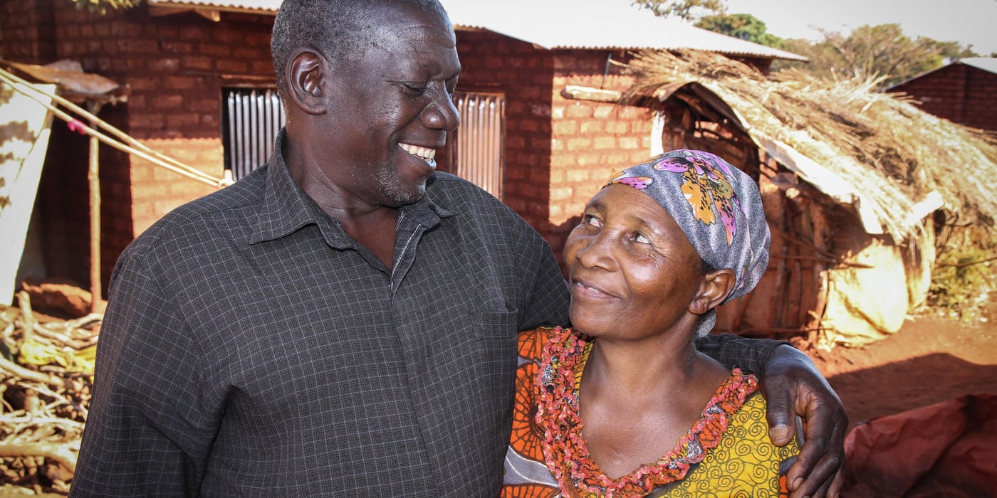 Bahekeye is a calm and soft-spoken gentleman who lives together with his wife Perose at Mtendeli refugee camp. They have spent one year in Mtendeli (since April 2016). He was moved from Nyarugusu where he spent another year. Back in Burundi, Bahekeye was living in Nyanzalake, Bukeyi Village of Makamba Province. They have two children, aged 17 and 18 years old.
Perose explained that life in Burundi was very difficult. “My husband spent many years in the bush hiding from militias and spooky agents who were trailing him every day,” she said.
What are your most immediate needs? “We need peace and harmony around us. However, we cannot go back to Burundi, but we do not have land to farm in Tanzania. Therefore, it is a catch-22 situation,” says Bahekeye.
He fled Burundi due to lack of peace. “We had been refugees before, living in the old Mutabira refugee camp. But when we went back to our homeland, we found that our land had been repossessed. There was alos lots of conflict around land ownership. But the main reason for the unrest was political instability surrounding the presidential situation,” he says.
Their first born son Buchumi who used to take care ofthem became a target of killer militiamen who accused him of supporting the opposition. Buchumi had to abandon them and run away. The old couple remained without help.
They walked at 4am for a period of three hours. This timing was necessary to avoid being detected by roving militiamen. There were 11 people on the road. At some point the groups split into two. Unfortunately, one of the groups that was led by Buchumi was stopped by security agencies and ordered to turn back.
Together with his wife and five children, Buchumi had no option but to return to Burundi where his life was in danger. “From Kagunga,, we were taken by boat up to Kigoma town. From Kigoma, a bus took us to Nyarugusu, we traveled six hours from Kagunga to Nyarugusu,” says Bahekeye.
‘We have spent many years of our lives running from deadly situations. It is very tiresome. All our children were born in refugee camps. We wish that we could find a peaceful place and spend the rest of our lives in tranquility,” he says.
How did they meet?
“Perose was a young beautiful girl in our village. I was a young ambitious man. I visited her home several times and noticed her. Now she is old but had you seen her at age 17, you would be very much captivated by her looks,” says a Bahekeye as he remembers the old days.
Photo: NRC/Ingrid Prestetun