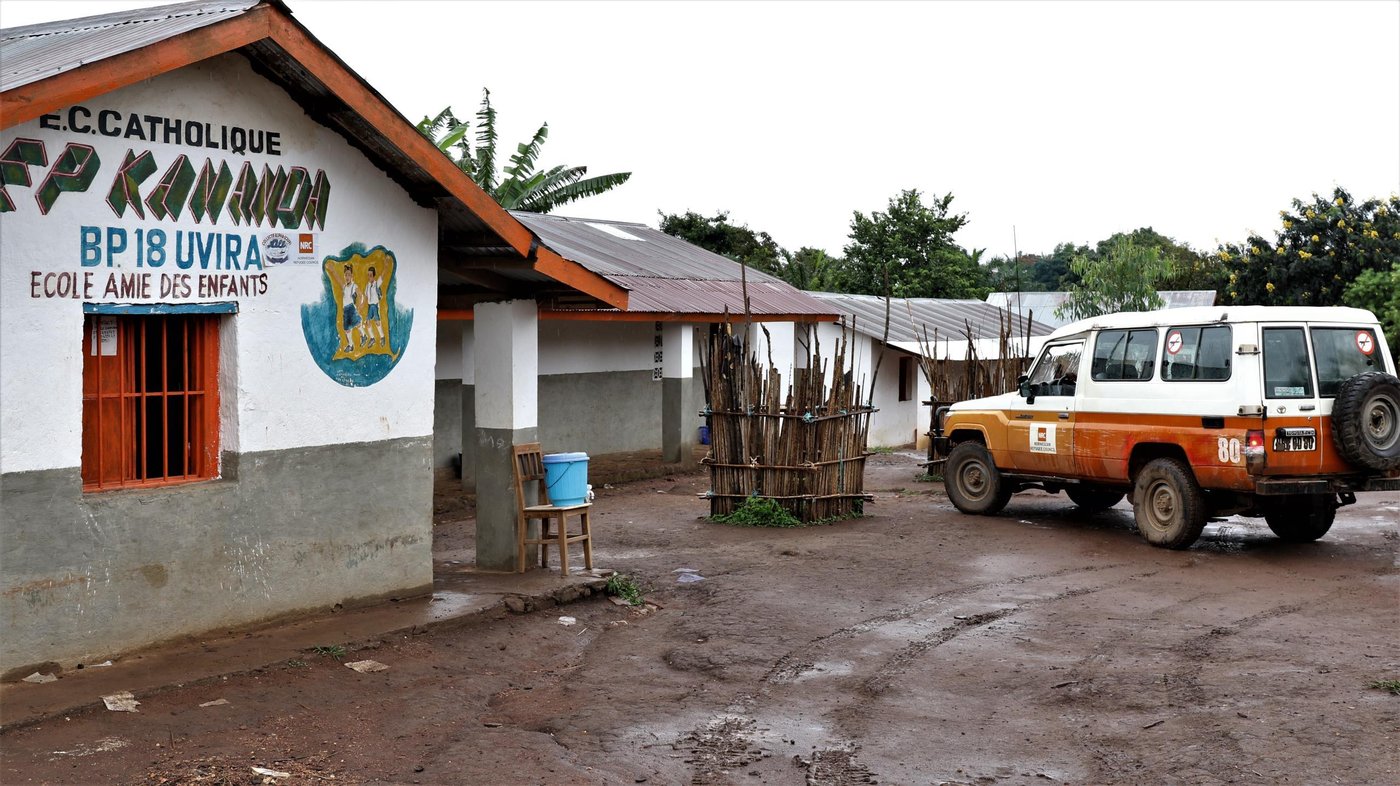 Kananda Primary School is just one of 32 schools rehabilitated by NRC in South Kivu province. Due to roof damage from bullets, when it rained, students would have to suspend classes, as the inside of their classrooms would begin to flood. In addition, the sanitation infrastructure in the school and throughout the village was dilapidated or non-existent. Students were risking both their safety and health by using the crudely constructed latrines. Being that the latrines were uncovered, students were vulnerable to infections and water-borne diseases.
With Education Cannot Wait donor support, NRC has patched the damaged roof to ensure that classrooms, students and materials remain dry when it rains. Metallic doors and window frames were provided, and the school was repainted. Latrines were rebuilt and covered for conditions that are more sanitary. The learning environment has greatly improved and the number of enrolled students has increased from 240 students in 2018 to 340 students in April 2019.
This assistance, however, is only a drop in the ocean. There are huge needs, which are still unaddressed within the province and throughout the country. We need further funding efforts so that we can continue rebuilding destroyed schools, organise catch-up classes to help children out of school so that they can access quality education in a safe and protected environment.
April 26, 2019
Photo: Ephrem Chiruza/NRC