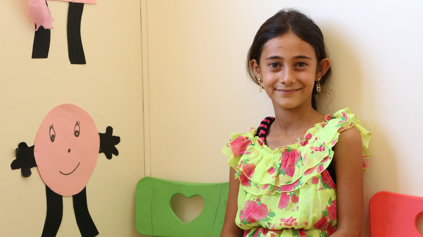 Yasmine, 10, is one of our students who is enrolled in the education program, in one of NRC's tented school in Lebanon's Bekaa valley.
"Here at NRC, we come to study. The English teacher, Lina, teaches us a lot of good lessons. I love the English subject, and I am very good at it," said Yasmine.
She continues, " I like studying because I have fun with my friends at school, and we study. When I grow up, I want to teach students at the university. I want to teach students things that they benefit from.
Yasmine likes to spend more time at the school, rather than staying at home doing nothing or fighting with her siblings.
Her favorite subject is mathematics, because she feels active when she studies it, " my brain works comfortably, it motivates my brain just like sports motivates my body. I want to be a mathematics teacher in the future," said Yasmine.
"My father helps me in doing my home works that I don’t know how to solve them, but he usually encourages me to study by own and depend on myself," Yasmine explained.
She wishes that she can go home to Syria, so she can meet het grandmother and aunts again. " What I miss about Syria the most , is sitting with my aunt, Reem, in our garden, where we drink “Matte”, and listen to music," Yasmine concluded.
Photo: Elias Abu Ata/NRC.