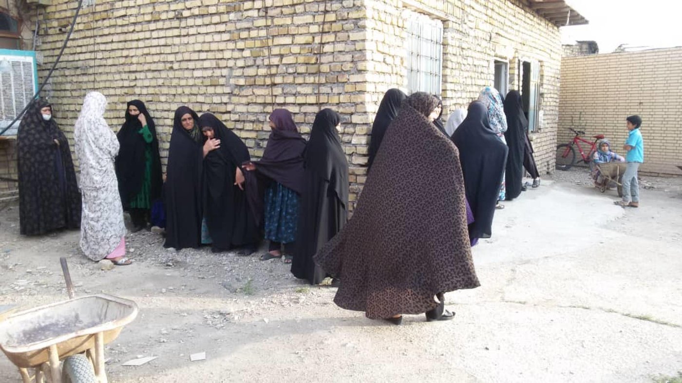 People line up to buy food and groceries at the market in Mohajerin Settlement in Semnan following the cash distributions by NRC via WFP cards, generously funded by the Norwegian Ministry of Foreign Affairs. Photo: BAFIA