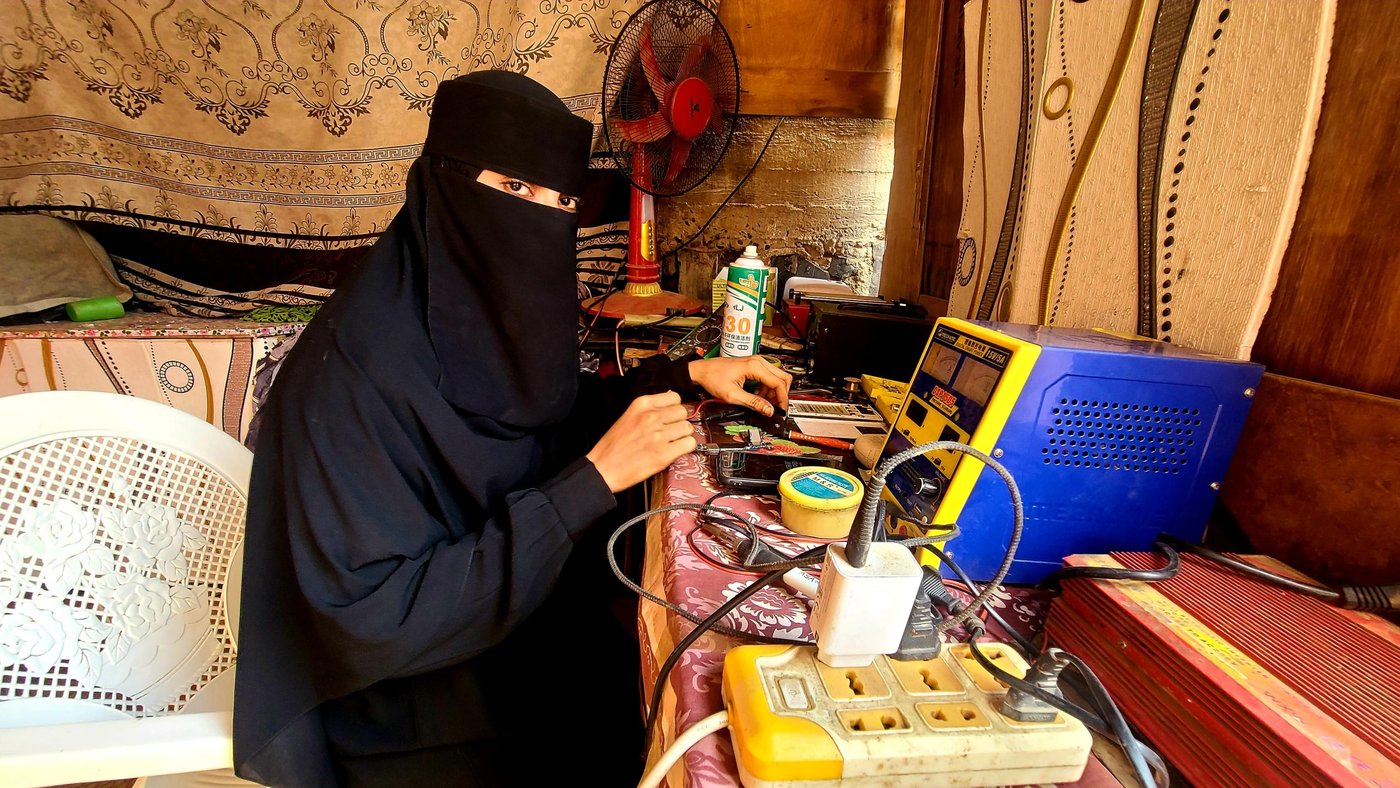 Portrait of Amal in her mobile maintenance workshop. 