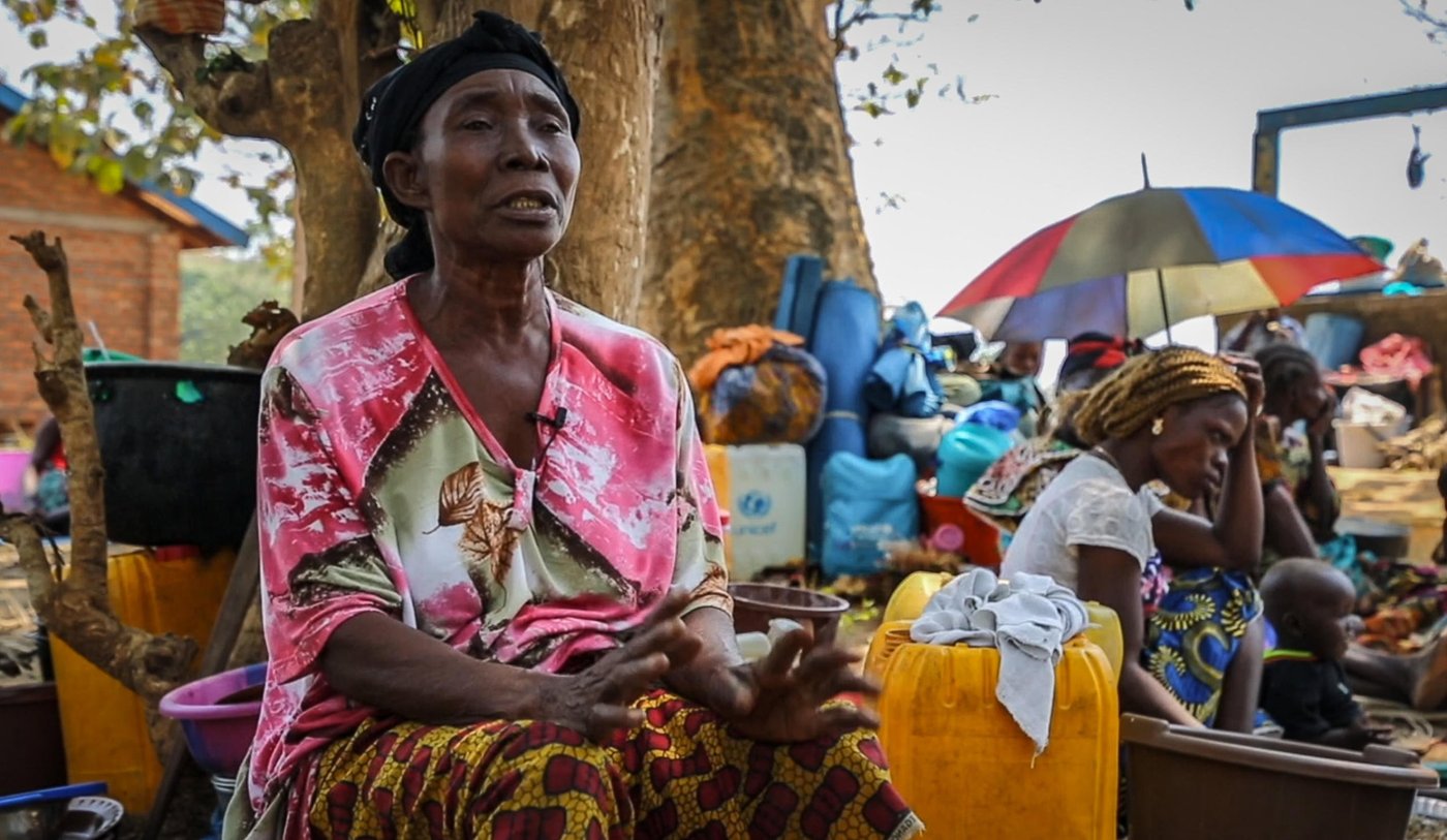 Anne fled her village when armed groups attacked in the morning of the 19th of January. She was going back home from the church when she saw armed men arriving from the bush.

"I saw them deep in the bush. My house is at the end of the village. They came in a column. As soon as I saw them, I immediately understood that it was the rebels. 

I left immediately, without taking anything. I only caught what was around me.

Since we have been here, we have stayed under this tree. We are on the ground. We are suffering a lot and we have nothing to eat.

It was the good people who brought us cassava leaves. The price of cassava has risen and we are finding it difficult to eat.

Even the children are suffering. They have lost all their school supplies. They go to school without a bag, without a notebook, without a slate, without clothes. What I can tell you is that we are suffering," says Anne.

Date: 8th February 2021
Location: Liton village - 22km from Bangui
Photo: Tom Peyre-Costa/NRC