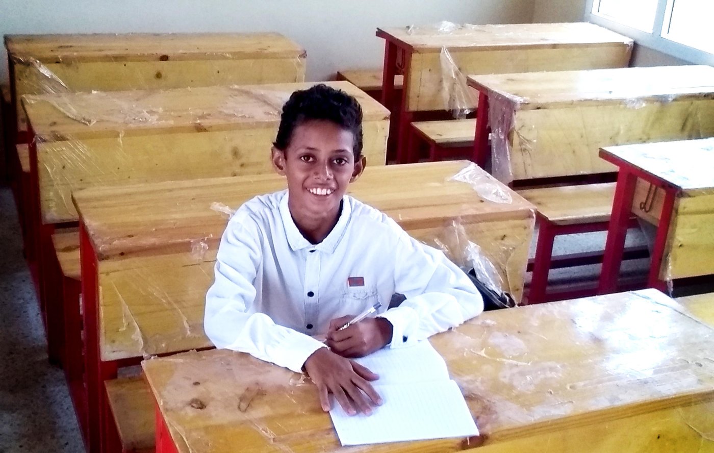 Mohammed in his new classroom at Al-Zaqriyah school. He doesn't need to sit on floor as NRC intervened and rehabilitated provided the schools with enough benches.

Photo: Abdulrazaq Mohamed