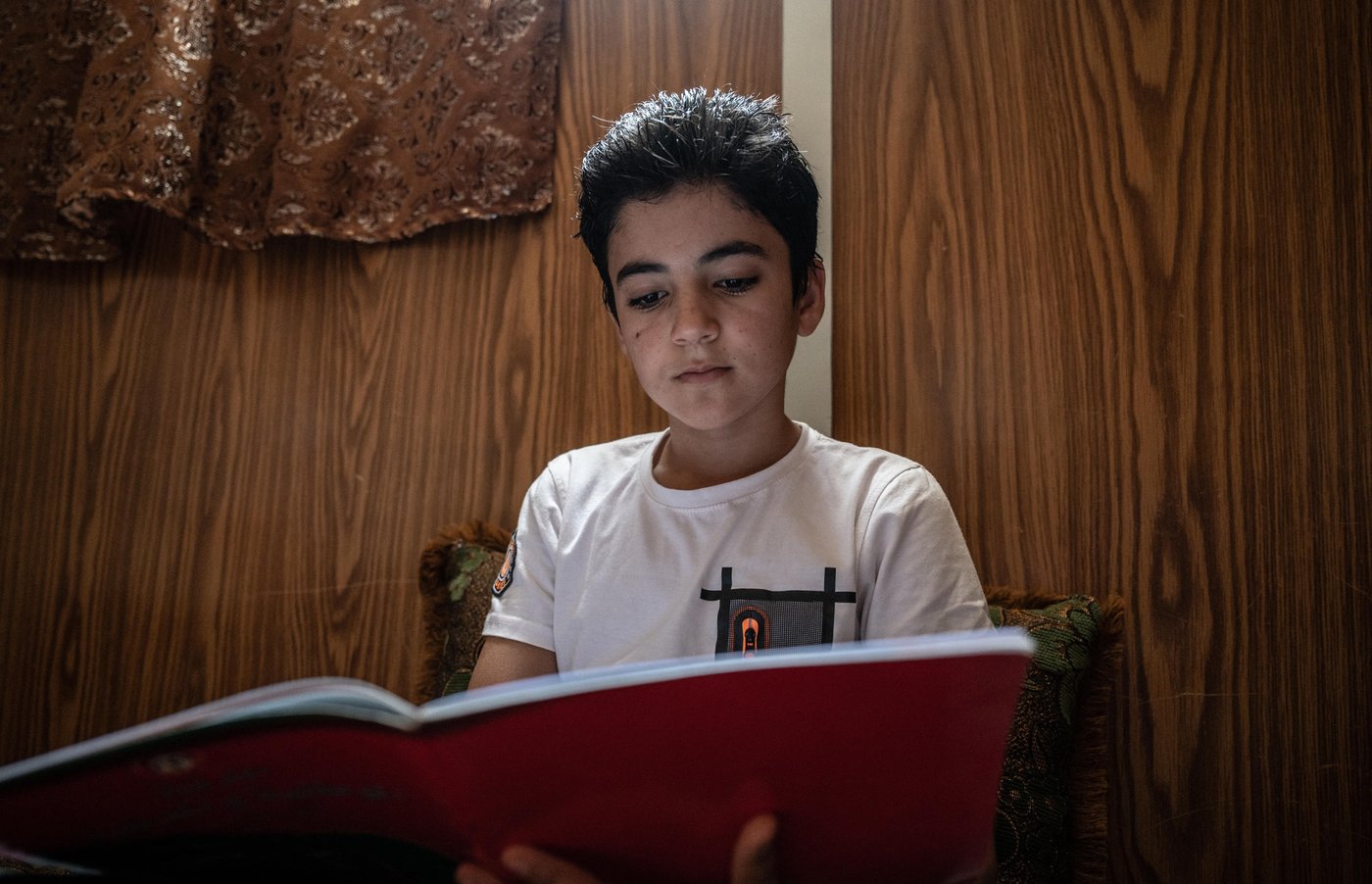 Photo: Daniel Wheeler/NRC
Details: 12-year-old Shaher is originally from Dara'a, Syria. He has lived in Za'atari Refugee Camp since fleeing the war in Syria in 2013. He lives with his mother, father and two younger brothers.
"I am scared of the virus. I feel stressed all the time and it makes my head hurt. We are trapped in a prison with the virus."
"There's rumours around the camp that if there's an outbreak, we won't survive."
When asked what he believes will happen if he becomes infected, Shaher replies: “Maybe life. Maybe death.”