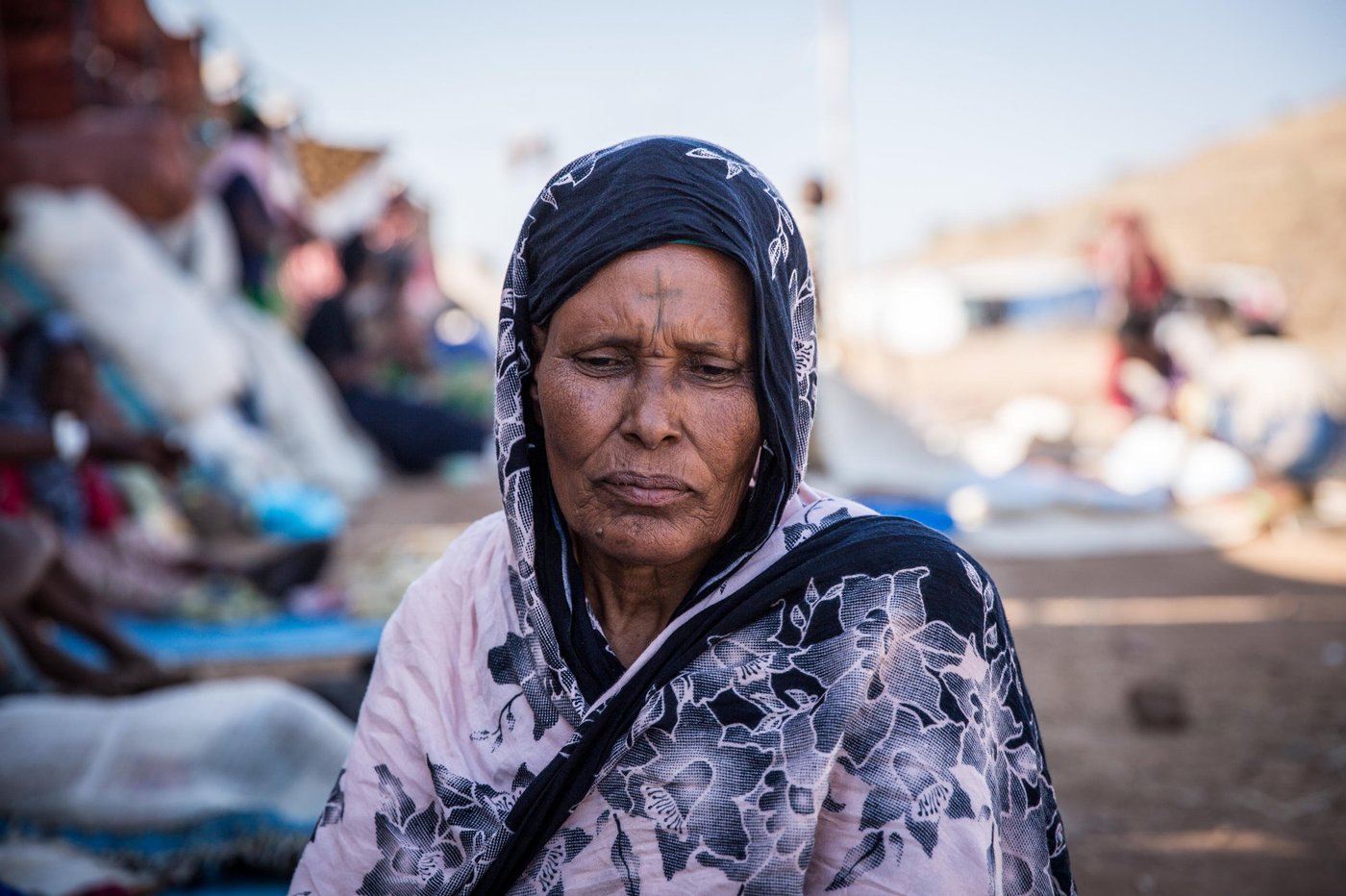 Melashu, 65 years old fled with her family of 6 and some of her close neighbours from Tigray to Sudan two weeks ago.
"We saw many dead bodies along the road when we fled. No one was burying them", she told NRC.
"My son-in-law is missing. Some of my closest neighbours are missing too. I have not been able to reach them. I worry."
Photo credit: Ingebjørg Kårstad/NRC