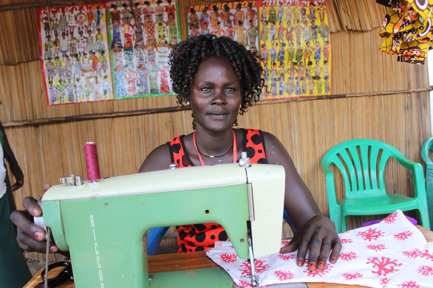 Sarah Nyakek (22) is one of the trainees from NRC's Vocational skills training centre in Rhino camp who has finished her tailoring course and is looking forward to setting up a shop in Ocea refugee settlement zone. She crossed borders into Uganda coming from Malakal in Upper Nile state of South Sudan. She is a mother of three children. 'I look forward to a fruitful business involvement,' she says. Photo: NRC/Nashon Tado
