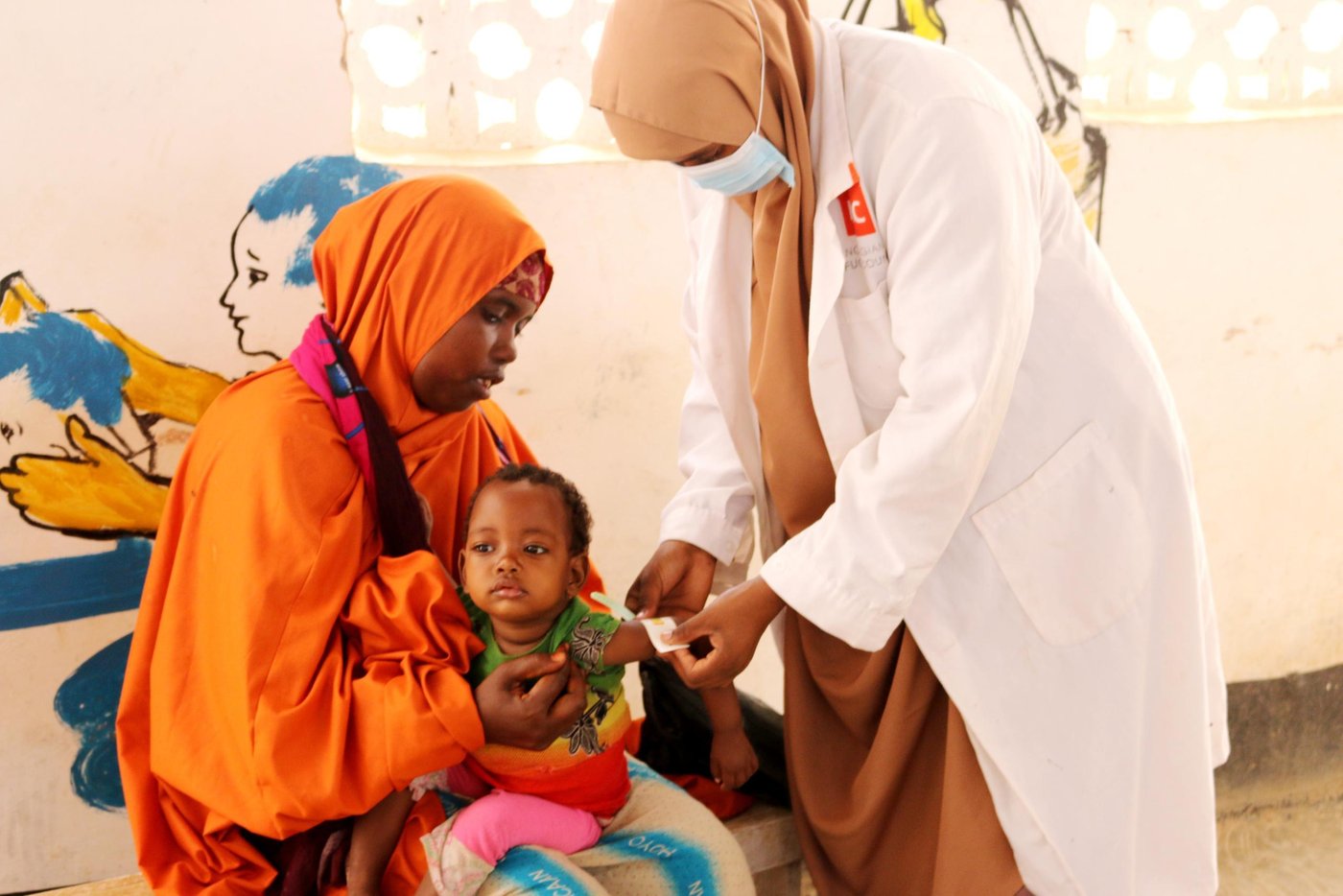 In early 2018, Khadija Mukhtar and her five children fled their home in Somalia due to prolonged droughts. They made the long and rough 217 km journey all the way from their home in Bardale to Baidoa town, the capital of the Bay region, in search of food and water.

Khadija’s husband divorced her when she gave birth to her first child  , leaving her struggling to feed her five children alone.  

During the long journey to Baidoa, access to food and water was very limited. At some points, Khadija wasn’t sure if they would make it. 

“The trip was never easy,” says Khadija. “I still remember the moment we stayed without food and water for a whole day. I didn’t have money. I didn’t have anything else to feed my children. I stopped at every village we passed to ask for food and water for my children.” 

“I felt like my baby was dying”

Khadija and her five children now live in Hanano camp for the internally displaced in Baidoa town. She earns a very small income through casual work which is not enough to feed her five children. Khadija’s baby daughter, Fatima, became sick and severely malnourished. 

“I felt like my baby was dying. She became weak,” recalls Khadija. “She was not eating anything. I felt awful, but I didn’t know what to do. I didn’t have money to take her to hospital. Fortunately, I heard one of my neighbours saying that there’s a health centre in our camp for sick children. I didn’t hesitate. I ran immediately to the health centre.” 

Khadija arrived at the maternal and child healthcare centre in Baidoa, supported by the Norwegian Refugee Council through BRCiS consortium. Eleven-month-old Fatima was found to be severely malnourished, weighing less than 6kg. 

After the diagnoses, treatment began immediately and her condition started to improve. The baby regained her appetite and she began gaining weight. After ten days as an inpatient, Fatima was discharged from the stabilisation centre to continue with the outpatient therapeutic programme (OTP) for three months where nutrition services are provided. 

“I am happy with the immediate treatment and the help my daughter received from the health centre. I was not expecting to receive this. My daughter got the help she needed just in time. 

Thank you to everyone who contributes to this much needed health service.”

***
Thanks to the funding support from the UK’s Foreign, Commonwealth and Development Office (FCDO), the maternal and child healthcare centre provides urgent treatment for children suffering from severe acute malnutrition. For some children who are very ill, like Fatima, this treatment saves their lives. 


About the BRCiS Consortium 
The Building Resilient Communities in Somalia (BRCiS) Consortium was created in late 2013. It was founded by a small group of people who had been working in Somalia in 2011 and had seen the famine unfolding before their eyes. The famine took a huge number of lives and pushed Somalis to the limit in their struggle for survival amid one of the world’s longest and deepest crises.
Somalia and the international community had clearly been caught off-guard. As a result, the UK’s Foreign, Commonwealth and Development Office, one of the country’s main humanitarian donors, decided that they would change the way they funded aid in Somalia. They committed to multi-year, flexible interventions, supporting the capacity to adapt to change and reduce risks. Thus, the BRCiS story began.

Four years of resilience building in Somalia has taken the BRCiS Consortium on a rich learning journey. The BRCiS approach is based on the principle that resilience programmes must be informed by the people they are designed to serve. We aim to stand by communities during hardships and offer a certain degree of protection, while promoting self-reliance and dignity.

This inclusive approach has led to impactful and sustainable programmes with a high level of community acceptance, that address local challenges and deep-rooted vulnerabilities.

Photo: Mohamed/NRC