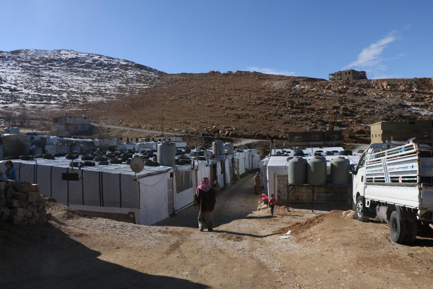 Lebanon has the highest number of refugees per capita in the world, amounting to over a quarter of the country’s total population. This has created a huge strain on its infrastructure and public services. 

Under Lebanese law, Syrians and Palestinians are not considered refugees, but “guests” granted temporary hospitality. The Lebanese government opposes the creation of formal camps, and its building codes and policies restrict the construction of permanent shelters. Many concrete homes previously built for refugees have had to be destroyed. 

Photo: Racha El Daoi/NRC
