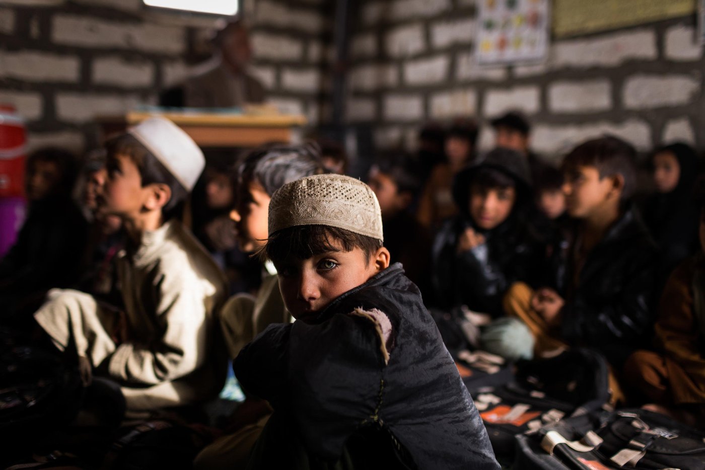Students attend class at an elementary school run by NRC in the Gulan refugee camp.

Khost, February 2017

Photo NRC/Jim Huylebroek