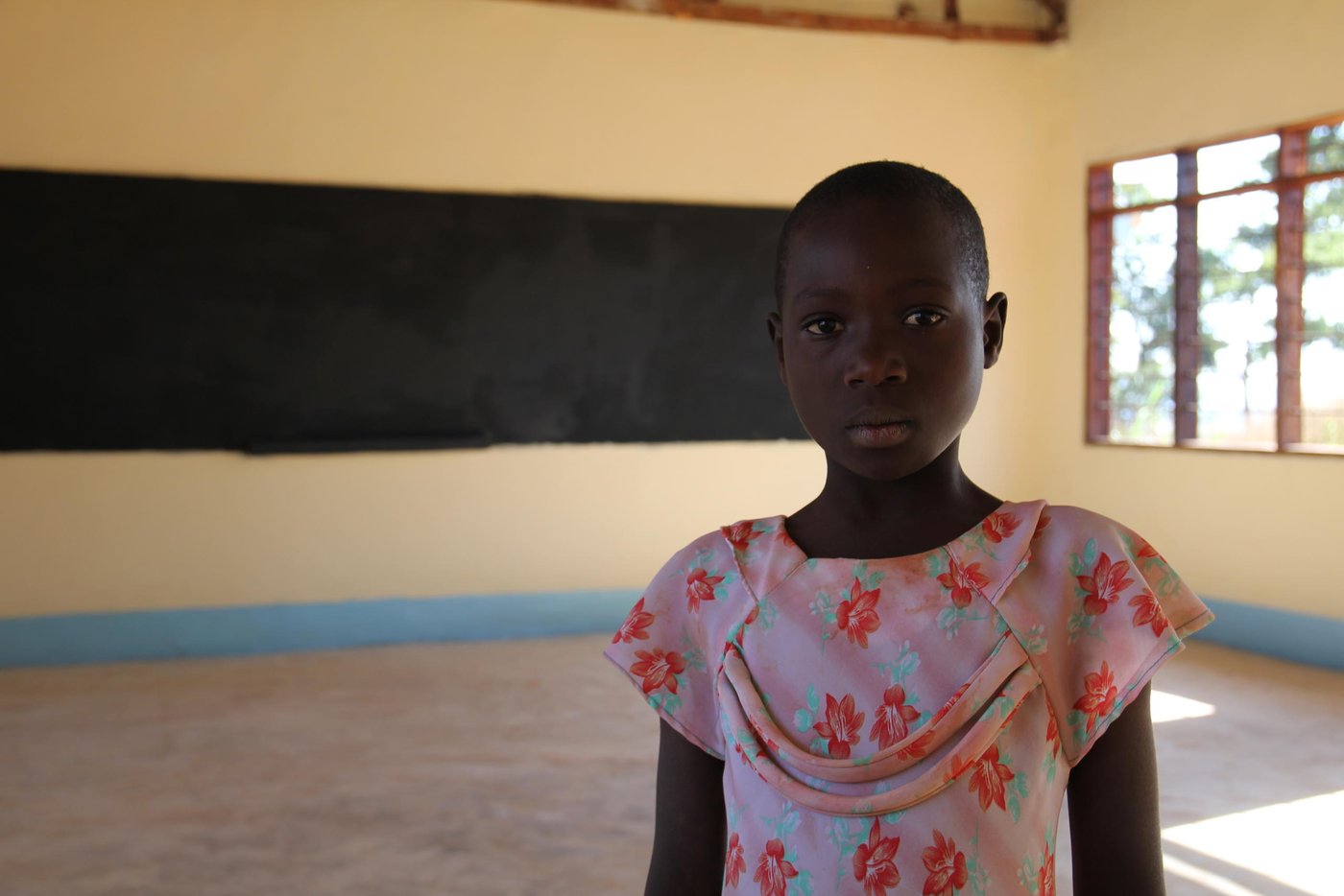 Diane (10), left Burundi while in Class Three at Kumwumi Primary School. However, while at the camp, Diane has not been able to resume school. She lacks the basic learning materials. “I do not have clothes, shoes, books, pen, ruler and a school bag,” she says.
However, Diane is excited about the prospect of returning to class. She is one of the pupils who will start schooling at the primary school being constructed by NRC in Mtendeli.
Diane quotes (from June 2017 interview):
“In Burundi, I liked to study. I had materials: clothes, shoes, exercise books, rubber, pencil, mathematical set, pen, shoes and body lotion.”
“We had a charming teacher who made us laugh. The school was built well and I had a friend.”
“In Burundi, I had a friend. I miss my father. I miss my friend. I miss my teacher who made us laugh. I miss my home.”
“What made us flee was political warfare. People were killed, taken at night, we could not know where they had taken them. Even my father, they took him at night.”
“In Burundi because there was a selective war, I stopped school for one year. I see they are building schools here. I pray that I also study here.”
“In Burundi, I likes Mathematics, Kirundi. I want to teach. I want to become a teacher too.”
“At school in Burundi, I likes Mathematics, Kirundi. I want to study. I want to become a teacher too.”
“In school, I likes Mathematics, I liked Kirundi, I wanted to study very hard so that I become a teacher too.”
“I see they are building the school there. I am happy because they are building. I will also go to study there to get knowledge.”
“I am hoping I will also be taken to study at that school.”
“I am happy because I see they are building the school and I have been selected to study from that school.”
“Thank you for listening to my story.”
“I hope I will get teachers who will make me laugh like those that I had in Burundi. I hope I will get friends as those I had in Burundi.”
Lyrics of her song: “When Petro was still young, he saw other children going to school, he escorted them. On the way he turned back, while very sad, then he told his parents, to bring him to school. When he started school, he did not delay to finish, and now he succeeded, he is teaching other pupils. He is teaching other pupils.”
Photo: NRC/Ingrid Prestetun