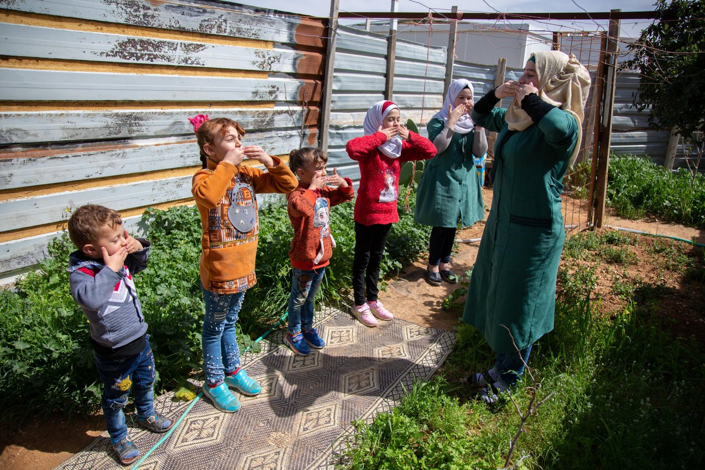 Whenever she senses her younger siblings are stressed, Malak employs the calming techniques she has learnt from the BLP to help. Photo: Leen Qashu/NRC.