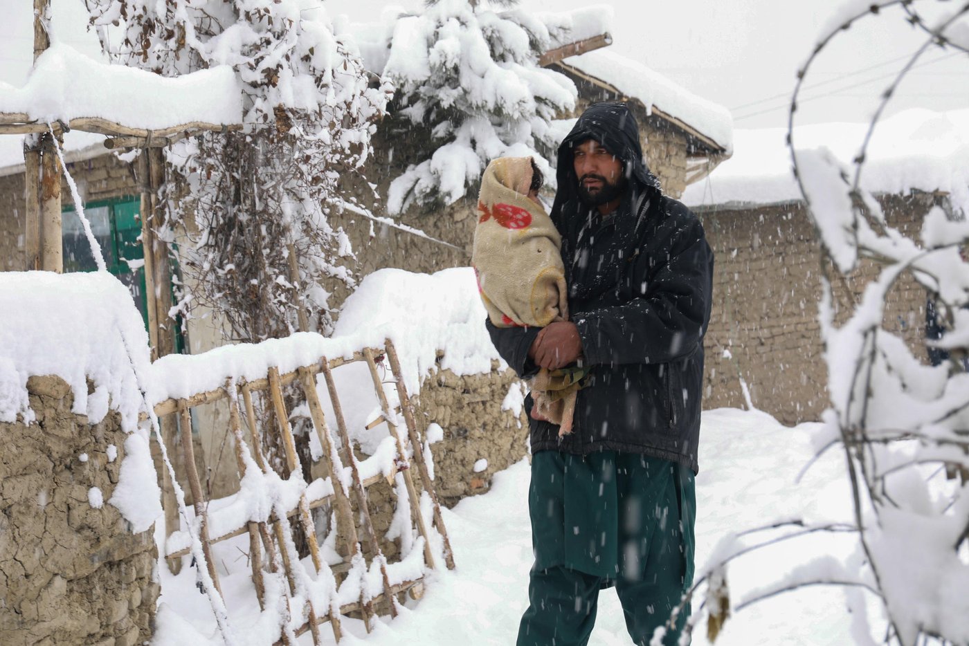 Mirwais, 42, is taking his one and half year-old son Ramin, to a doctor. Ramin has been suffering headache, fever and abdominal pain in the past three days. “he has been suffering in the past three days and I was hoping he could get well without being taken to the doctor. I can’t afford their medicine and he is the second one I’m taking to the doctor,” Said Mirwais.
Kabul and major parts of Afghanistan is blanketed in snow and Mirwais and thousands other displaced men who are earning through daily wages can’t find anymore to protect their families.
“We can’t afford fuel or firewood to warm the room and cook. All we burn is plastics and cartons and that makes our children sick,” said Mirwais. Photo: Enayatullah Azad / NRC
