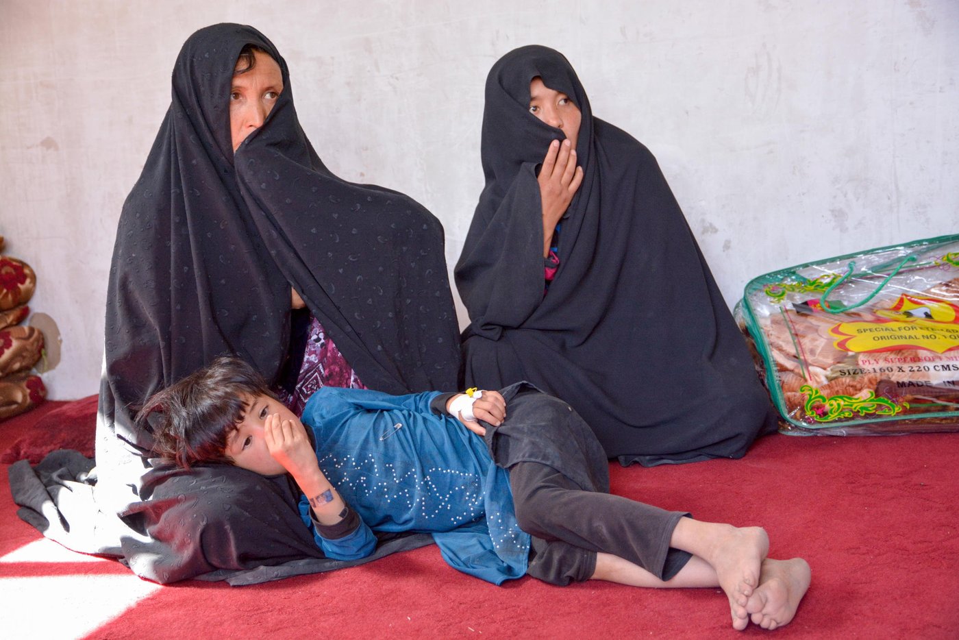 Dordana, 47, and her sister-in-law, Marzia, 28, have left with thirteen children. All male family members even the seventeen-year-old Baqir were killed during the Mirza Olang attack on August 5.
The armed militant group blocked the way while the family were fleeing from the village. The Taliban have separated the male family members and killed and took the women hostage.
Dordana, her sister in law and the children fled after three nights being hostage in their homes in Mirza Olang village.
NRC with support from ECHO have responded to the family with 28,000 AFS in order to cover the needs in terms of Shelter, fuel, electricity, health, and transportation.
Photo: NRC/Enayatullah Azad