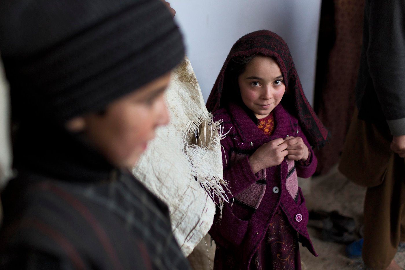 Eight year old Masooda and her family were displaced from their village in Almar district of Faryab province. Now they found shelter in a small room on the outskirts of Maimana, facing a harsh winter. Photo: NRC/Jim Huylebroek