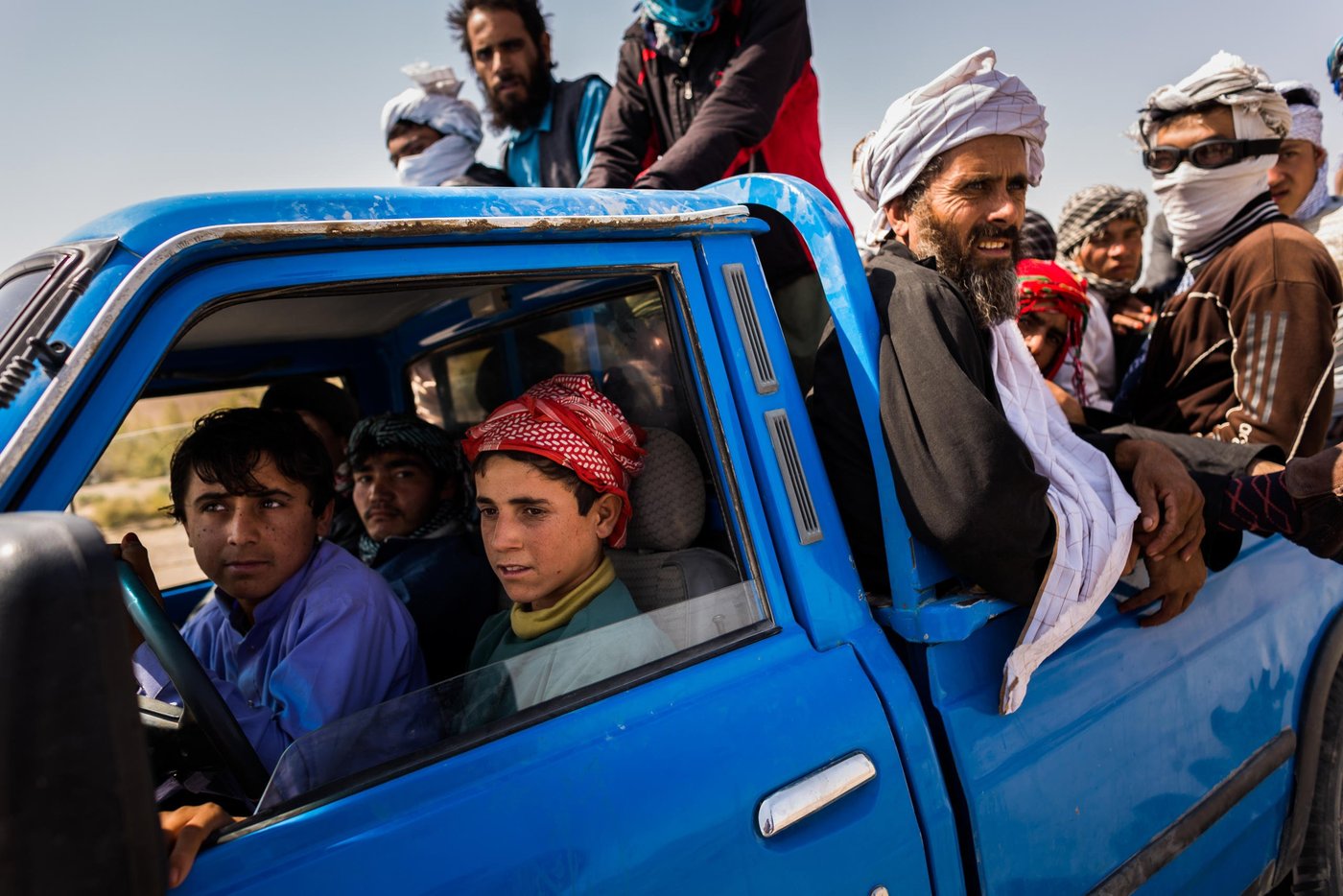 Boys no older than 13 from Helmand manoeuvre a pickup filled with refugees from Zaranj towards the lawless borderlands between Afghanistan, Pakistan and Iran.
Nimruz, September 2015
NRC/Jim Huylebroek